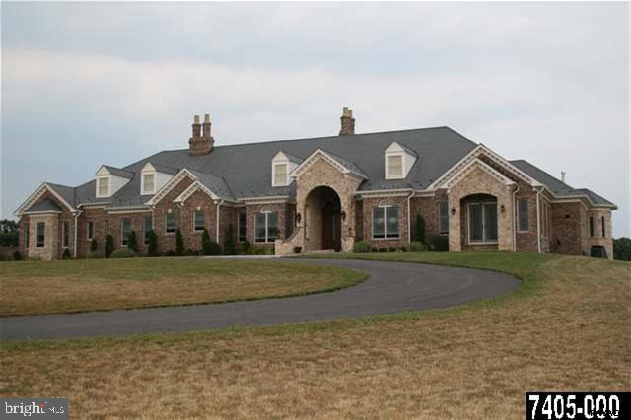 This 8000+sq' Luxury Manor sits on over 53 Acres and features state-of-the art amenities.Amazing Chef's kitchen with Cherry cabinets and professional style Appliances. Spectacular Owner's Suite will surely please the most discerning buyer.Six Fireplaces,Marble Flr Foyer,Game room w/full Bar,Theater Rm w/ramped Flr,Gym,Sauna, Radiant Flr heat,7 Car Garages & More