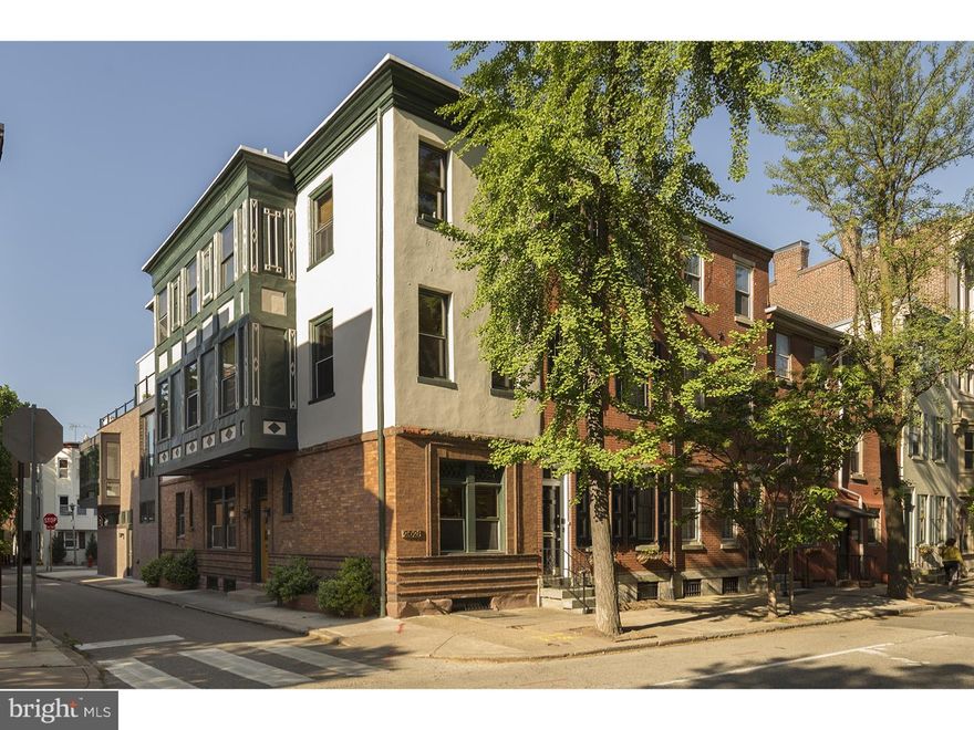 With a tucked-away city location on the corner of Pine Street and tiny little Capitol Street, this knockout city residence is a mix of beautifully updated, historical living space and an architect-designed, newer rear addition. Whether it's because of the heated attached garage and off-street parking or multi-level rooftop deck, or even the clever sunroom "connector" between the old and new sections, you must see this jewel of a property. The home's main entry area opens to a detailed stairwell with a family room (possibly a dining room) to the right, and an open and timeless, eat-in kitchen with updated appliances to the left. Beyond the kitchen are the all-new powder room, laundry room and mudroom entry from the garage (ideal for every city residence but rarely featured). A rear stairwell leads to a spectacular bedroom lined with windows, served by an en suite slate bath.  French doors lead to a sunroom, which was likely a second-story porch in the original design. It is now a comfortable lounge area, with access to the roof deck and French doors that open to a Juliette balcony. Additional French doors open to a living room, which features a wet bar, two under-counter refrigerators, granite counter tops and plenty of cabinet storage. This is a perfect space for company or everyday needs. A renovated full bath, classic with its Carrara marble and white fixtures, serves a second bedroom on this level. Gorgeous wood floors with perimeter inlays run throughout this area of the house and on the third floor. On the top level is an expansive, airy bedroom with a corner gas fireplace and access to the roof deck. A full bath (timeless with its subway tile and marble) serves this bedroom and a smaller bedroom.  The smaller bedroom can serve as a nursery or a separate sitting room/office to the main bedroom. Look up and see that the main stairwell is lit by a large skylight. This very comfortable home has plenty of extras, including ceiling fans, original wood interior doors, and natural light from three directions. The original front facade, with its stylized, terracotta trim, stands out on the street as historic, unique and charming. The location is well located to Rittenhouse Square and Fitler Square. Per Seller Square footage approximately 2500