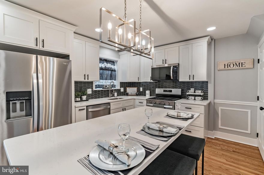 “Welcome Home” to this completely updated brick Colonial in a very desirable neighborhood in Springfield  on a lovely corner lot. Enter into the home and you will be  stunned by the beautiful refinished original hardwoods that have been restored to their natural 
beauty throughout the home. The large sunny living  room  has recessed lighting and an additional half bath. The adjoining dining room has french doors that lead out to a deck along with the open kitchen  floor plan . Both  
rooms also have recessed lighting and an island  that seats 3 stools with a modern island light. There are white shaker style, soft close cabinets with black hardware , white quartz countertops , black picket style backsplash, a garbage disposal and new stainless steel appliances . On the 2nd level there are 3 good size bedrooms with 
ceiling fans.The hall bathroom is complete with a modern flare with a tub surrounded with grey and white subway tile, a vanity & toilet with a tile floor. This house has been freshly painted throughout and has new windows , new baseboards, trim, & interior doors,  new HVAC, ) converted from oil to gas)totally  rewired  electric with a new 100 amp panel including  a new electric hot water heater . The plumbing has been replaced with pvc & pex including a new stack.
The basement is fully finished with LVP flooring, 
carpeted steps and an industrial look of a  sprayed black ceiling along with  a full bathroom with a tiled floor and a tiled walk in shower. There is a laundry area off to the back of basement with a storage area behind the HVAC system. All of the work done to the house  has been 
through permits with the township and has been approved & inspected. 
This beautiful home won’t last!  Bring your buyers today !