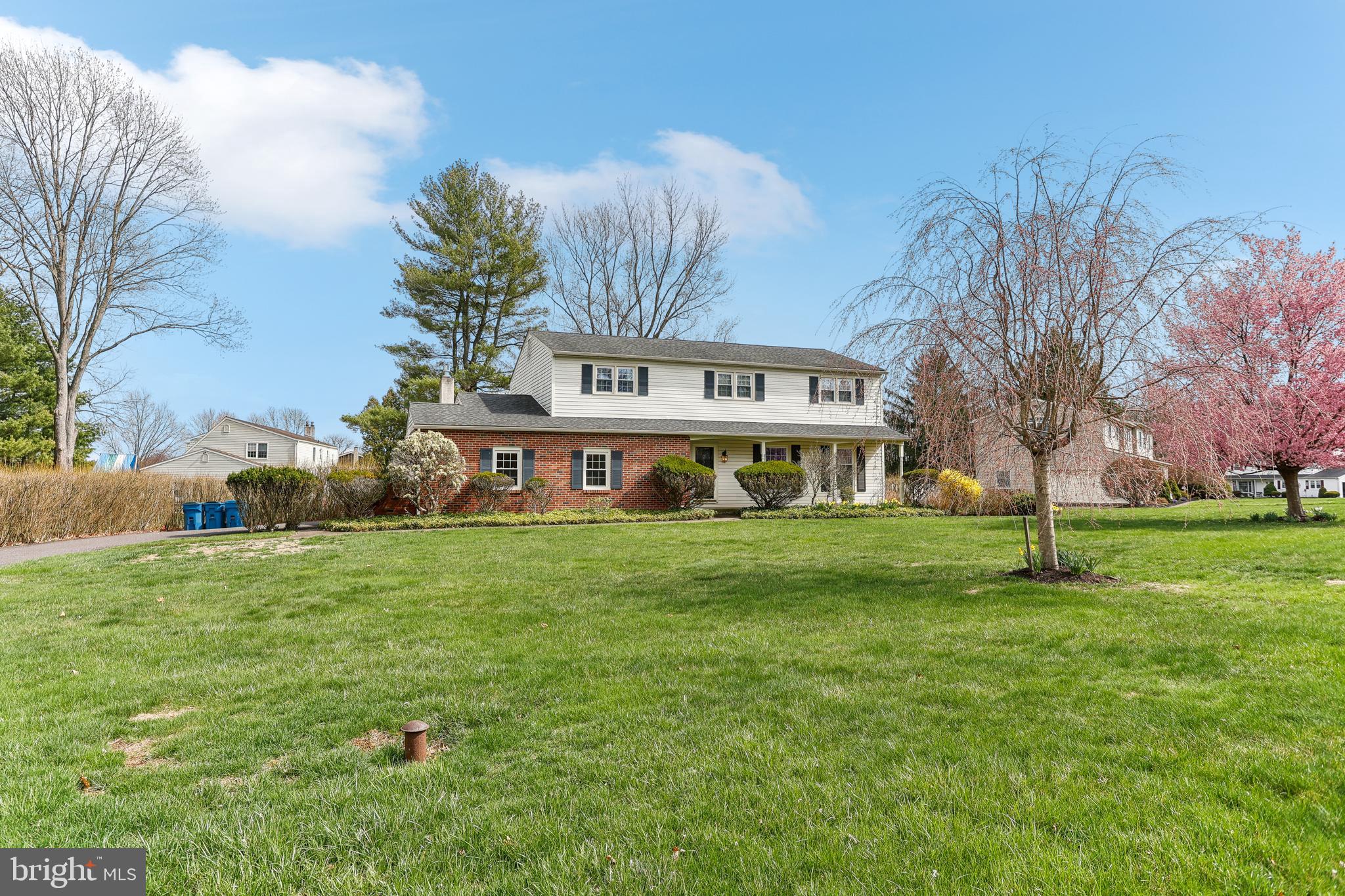 Don’t miss this rare opportunity to own a home in the highly desirable Oxbow Meadows community. Ideally located near shopping, dining, parks, and major commuter routes, this home offers the perfect balance of convenience and comfort. 9 Beechwood Drive is nestled in the heart of this charming neighborhood with an abundance of sidewalks perfect for leisurely strolls. Known for its serene atmosphere and the award-winning Central Bucks School District, this home truly stands out. Set on a spacious, flat lot surrounded by mature trees, this center-hall colonial features four bedrooms and 2.5 baths. With endless potential, 9 Beechwood is the perfect opportunity to add your personal touches and make it your own.
Step inside and discover the generous size of this 2,478-square-foot home. The expansive living room, bathed in natural light, flows into a dining room currently used as a game room. The updated, eat-in kitchen opens to a cozy family room with a beautiful gas fireplace and oversized windows that offer a peaceful view of the backyard. Upstairs, you’ll find a spacious primary suite complete with a newly updated shower. Three additional generously sized bedrooms offer ample closet space, along with a hall bathroom and an oversized closet for extra storage.
Step outside to a large deck, accessible from the kitchen, providing the ideal space for entertaining. With plenty of room for a dining table and seating area, it’s perfect for hosting family and friends. This home also features an attached two-car garage, making unloading groceries or arriving home on a rainy day a breeze.