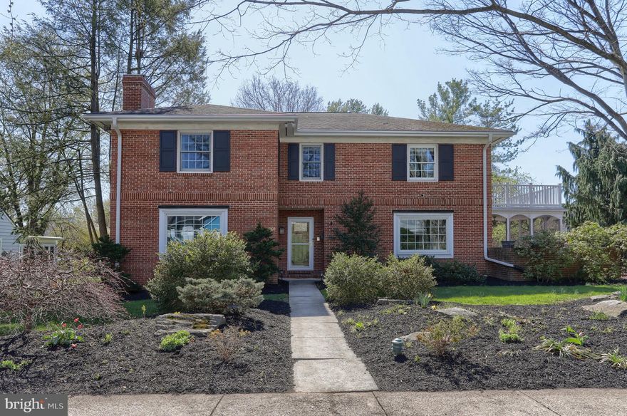 Welcome to Hershey - The Sweetest Place on Earth.   This classic traditional all brick home 2 story sits on .34 acre  located in a quiet, residential neighborhood.  It is very deceiving from the street.  Be sure to drive down the alley behind it to see the depth of the home.  The interior  has been updated over the years and features 3,492 square feet above grade and 900 sq ft finished in the lower lever.  You enter a large foyer featuring hardwood flooring, oversized crown molding, chair rail, picture frame moldings and large coat closet.  The formal living and dining rooms, situated on either side, provide elegant spaces for hosting guests.   The living room boasts a gas fireplace with a marble hearth and custom mantle.  There is a wall of built-in shelving and cabinetry on both sides of the fireplace.  The oversized crown molding, picture frame molding and large picture window for natural light add to the charm of this room.  The dining room features hardwood flooring, crown molding, picture frame molding, new light fixtures, picture window for natural light and French doors leading to the custom screened porch.  The kitchen has been upgraded with cherry cabinetry, an island and the large breakfast area which is perfect for casual dining.  The new slider in the kitchen has access to the patio area with the hot tub and the fenced yard. This area is perfect area for outdoor enjoyment.  There is also a door to the screen porch that offers privacy with mature landscaping and will be a perfect place for an early morning cup of coffee or glass of wine in the evening after work.  If you work from home, the first floor office has built-in shelving and a large closet.  The powder room is tucked away on the main floor.  A few steps away is the large family room with a gas fireplace featuring a wood mantle, slate hearth and stone surround.  It is flanked by 2 sliders for natural light in this room.  There is access to the patio/hot tub area.  There is also a bedroom and full bath on this level which is perfect for guests or long-term company. The second level features a large primary suite with a new primary bath that was recently added by converting a small bedroom to the oversized elegant bath.  The new soaking tub, custom shower, dual bowl vanity and other upgrades will be appreciated by the most discriminating buyer.  The second bedroom has access to the hall bath.  The 3rd bedroom on this level has its own new bath (formally the primary bath) and a sitting area above the screened area below it.  The oversized laundry is conveniently placed on the 2nd floor and has built-in cabinetry, a sink and closet.  And that’s not all – the finished lower, accessible from the garage, features a full bath, has a new egress window,  mini kitchen and entertainment area – ideal for an adult child or extended guests.  The mini kitchen features a sink, refrigerator, and upper and lower cabinets.  There is a comfortable balance between indoor and outdoor living space.  It is perfect for a large family with all the different living areas.  This home reflects a classic suburban style home, often associated with solid construction and practical layout.  The architecture, updates, mature landscaping and proximity to Hershey schools make this a rare opportunity in Hershey.  It is within a 10 minute drive to downtown, the Hershey Medical Center, attractions and shopping.  This is the perfect combination in Hershey.
