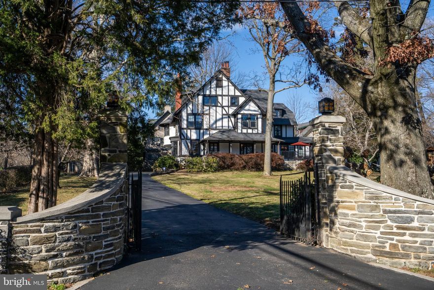 Stunning 6 bedroom, 4 full and 2 half bath Tudor home in Merion Station with separate 2 room Au-Paire Suite, attached 2.5 car garage, newer Pella windows throughout, finished basement, gorgeous kitchen, tall ceilings, gleaming hardwoods throughout, a working 3 passenger elevator and plenty of natural light   located in a wonderful neighborhood just 2 blocks to the Merion train station within the Lower Merion School District and zoned to Merion, BC and LMHS. This home is magnificent with all the old world character yet completely modernized for today s buyers! Enter this lovely home to find soaring ceilings and an elegant foyer with powder room, down the hall find a dramatic formal Dining Room and a fabulous living room with built-in cabinetry, gas fireplace and doors out to a delightful flagstone patio and covered porch with new hot tub. Off the Living Room is a spacious, sun filled Bonus Room separated by pocket doors featuring gorgeous millwork and walls of windows that could be used as a playroom, home office, music room or even yoga studio! At the heart of the 1st floor is the stunning kitchen which offers rich white cabinetry, quartz counters, large center island, stainless commercial appliances, plenty of cabinet space and a full breakfast room with additional built-in cabinetry and 2 separate desk areas! Off the kitchen is the coveted Family/Great Room with built-in cabinetry, bay window and gas fireplace. Continue on to find a Mud Room with cabinetry, cubbies and inside access to the 2.5 car garage. Plus, there is a separate room for additional storage or 2nd washer/dryer! Follow the gleaming hardwoods upstairs to find a bright bonus room open to the hallway that can be used as a home office or additional bedroom. The Master Bedroom Suite is exquisite and complete with sitting area, gas fireplace, large his and her walk-in closets and beautiful Master Bathroom with double vanity, soaking tub, Marble shower and floor with radiant heating! Laundry room, 2 nicely sized bedrooms and hall bath with double vanity complete this floor. On the 3rd floor you will find 2 large bedrooms, a full hall bath PLUS a private, 2 room Au Paire suite with full bathroom! Last but not least, the basement is finished into 2 separate rooms for endless possibilities. Set far off the road, this home is convenient to everything yet secluded and private. Minutes walk to the Septa train and quick drive by car to Wynnewood Shopping Center, new Whole Foods and so much more.
