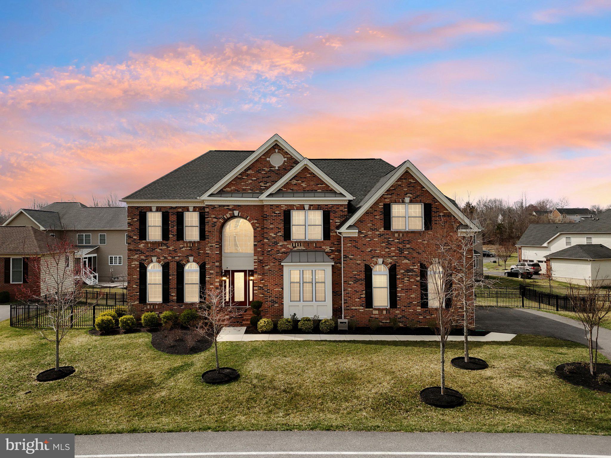 Fall in love with this impressive Toll Brothers gem with over 6300 sq of total living space. Nestled in the prestigious gated community of Oak Creek, this home captivates with a luminous and practical interior. Step into a grand 2-story foyer and admire the sweeping staircase. Sun-drenched interiors showcase generous rooms, including formal living and dining areas great for entertaining. Abundant windows and a soaring family room with a fireplace infuse warmth and elegance. The heart of the home, a gourmet kitchen with stainless steel appliances, granite countertops, and dining area, features stunning wood flooring. This home is a stunner! Ready to call it a night? Retire into your Owner's Suite featuring a sitting room, en-suite with a his and hers closet, soaking tub, separate shower with double sinks. Entertaining guests; move the fun down into the finished lower level with a in-law suite, spacious rec area, bedroom and bathroom. Enjoy endless summers and cool autumn nights on the private screened-in deck. This home also checks all the boxes. This is a must see!