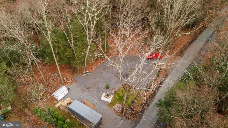 LIFE IS GOOD! This peaceful little getaway is perfectly suited for the camping enthusiast! 1.48 acres of both cleared and wooded land, on site electric, septic holding tank and on site water- you can even hook up to the internet if you so chose! Beautiful stream surrounded by wooded land, on site campfire and permanent Trek deck patio to sit on, enjoy the campfire and nature's surroundings! Just bring your RV or Camper and you are all set! Quick trip to many local Wineries, Distilleries, Historical Jim Thorpe, White Water rafting and so much more! Easy commute to PA Turnpike and many major travel routes! Make this your home away from home and call today for your private showing!