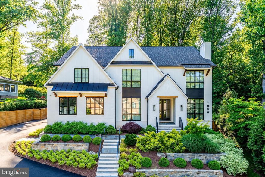 Just reduced! UNBELIEVABLE value.! Truly a must see. Welcome to 1544 Forest Villa Lane, an extraordinary custom home in the heart of McLean, VA, offering nearly 8,000 sq. ft. of meticulously designed living space on 0.47 acre beautifully landscaped grounds. Crafted with an uncompromising commitment to comfort, efficiency, and style, this home blends luxurious living with smart home convenience and resort-level amenities.

Step inside to soaring 10-foot ceilings, striking 10.25" wide white oak hardwoods, and designer finishes throughout. The gourmet kitchen is a chef’s dream, featuring a Wolf 8-burner gas range, Miele steam and convection ovens, Subzero column refrigerator and freezer, and a stunning walk-in pantry with a sliding ladder, brick accents, and appliance shelving. Adjacent, the butler’s pantry showcases a mirrored backsplash, LED-lit liquor display, and a Subzero beverage fridge—perfect for entertaining.

The open-concept family room boasts a gas fireplace, built-ins, and built-in surround sound, while the office impresses with its fireplace, custom cabinetry, and art TV. Upstairs, the vaulted lounge offers a cozy gas fireplace and another full surround sound setup. The primary suite is a sanctuary unto itself, with blackout shades, vaulted ceilings, a spa-like bathroom with heated floors, steam shower, stand-alone tub, dual water closets, and boutique-style his & her closets.

Smart features are embedded throughout, from Nest thermostats and ceiling-mounted EERO WiFi routers to a 38kW Kohler whole-house generator and two Rinnai tankless water heaters. The entire home is insulated with spray foam and soundproofing for quiet, efficient living.

Step outside to your private backyard oasis featuring a resort-style heated saline pool and oversized spa (both WiFi controlled), custom Italian tile, in-pool sun lounge, and a built-in fire pit on the patio. Entertain year-round with a full outdoor kitchen with bar seating, AMG grill, Bull pizza oven, and dine under a pool side pergola while listening to the exterior sound system. The screen porch adds a four-season retreat with Bromic electric heaters, gas fireplace, retractable screens, and Sonos surround sound.

Additional highlights include a 3-car garage with EV chargers; a fully finished basement with gym, safe room, yoga studio, and guest suite; and extensive high-end mechanical systems like whole-home HEPA/UV HVAC filtration, whole-house water softener, and a 32-zone smart switch panel.

This is more than a home—it’s an experience. Most furnishings are negotiable, allowing for a seamless move into this one-of-a-kind residence.