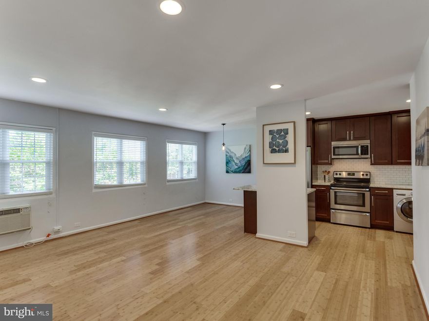 JUST REDUCED!! VERY RARE UNIT with open kitchen layout! Gorgeous, high end kitchen remodel w/ 42" cabinets, premium granite, stainless appliances. Gleaming hardwood floors throughout - no old parquet here! Recessed lighting, fresh paint, newer windows! Quiet location - off busy street. All in one w/d in unit. Lots of storage! Amazing community amenities such as pool, tennis courts & more!