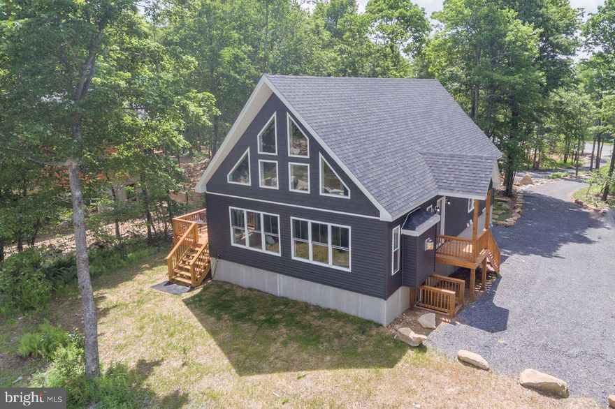 Right in the heart of Deep Creek Lake, this modern mountain chalet checks all the boxes - Directly adjoining the ASCI White Water course, riverside to the slopes at Wisp! Five bedrooms, four full baths, and over 3,100 square feet of smart, stylish space. Open layout with a sharp white kitchen, gas fireplace, and plenty of natural light. Game room with pool table downstairs. Loft and lounge space up top. Fully furnished, rental-ready, and packed with perks—hot tub, fire pit, central A/C, and smart TVs throughout. Built in 2021 and still feels brand new. Tucked just minutes from State Parks, restaurants, shops, and marinas. Call today for your private showing!