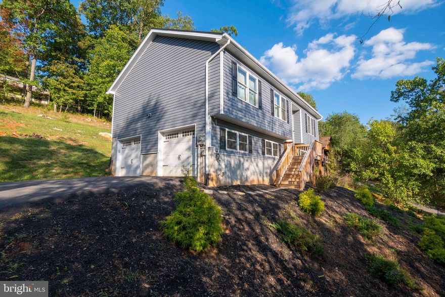 Just Like A New Home!  In Town Location, Minutes To The Shenandoah River & Eastham Park, With Walking Trail & Dog Park.  No HOA!  This Open Plan Home Features Cathedral Ceilings, Vinyl Plank Flooring Thorough Out The Main Level, Gas Fireplace In Living Room To Enjoy On Those Cool Evenings.  Large Kitchen With Granite Counter Tops, Stainless Steel Appliances, Kitchen Island & Tons Of Cabinet Space.  Separate Dining Table Area.  Hall Bath Features Double Vanities & Tile Floor.  Master Bedroom Freshly Painted, Large Closet,  Master Bath With Tile Floor. 2 Additional Main Level Bedrooms.  Finished Lower Level Offers Large Rec Room, Full Bath & Laundry Room With Access To 2 Car Garage With Storage.  High Speed Internet Available For Those Who Work From Home.  You Are A Short Distance To The Skyline Drive, Andy Guest State Park, Skyline High School & Minutes To Downtown, Shopping, Restaurants, & Entertainment.  Great Access To I-66 No Mountain Roads To Travel.