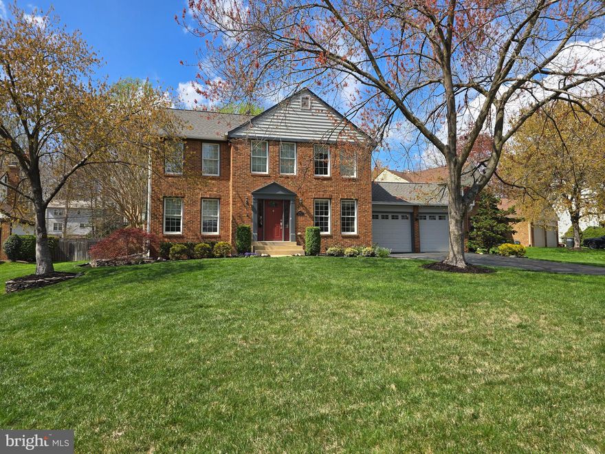 Welcome to a truly exceptional 6-bedroom, 3.5-bath colonial with a heated 2-car garage, nestled in one of Burke’s most sought-after neighborhoods, where timeless design meets modern comfort in a home thoughtfully crafted for both everyday living and elevated entertaining.

From the moment you arrive, the meticulously maintained landscaping creates a beautiful first impression, offering a sense of pride of ownership and a welcoming approach that continues throughout the property.

Step inside and you are greeted by a grand foyer with soaring ceilings open to the second floor, creating an immediate sense of space, light, and elegance. This impressive entry sets the tone for the home’s refined interior, where formal living and dining rooms offer the perfect setting for both intimate gatherings and larger celebrations.

Gorgeous hardwood flooring flows throughout the main level and continues seamlessly upstairs into all the bedrooms, creating a cohesive, elevated feel throughout the home.

The inviting family room, centered around a cozy fireplace, opens effortlessly into a beautifully appointed gourmet kitchen. Designed with both function and style in mind, the kitchen features a Samsung induction oven, an expansive center island, abundant cabinetry, and a generous pantry, making it ideal for everything from everyday meals to entertaining.

One of the home’s most captivating features is the stunning sunroom, filled with natural light and equipped for year-round enjoyment with its own heating. Whether you are enjoying a quiet morning coffee or hosting friends, this space offers a true extension of the home’s living experience.

A thoughtfully designed mudroom provides exceptional organization with built-in benches and ample storage, creating a seamless transition from the outdoors. Step outside to a Trex deck and dedicated grilling area, perfect for entertaining or relaxing in your private outdoor retreat, all surrounded by beautifully maintained grounds.

Upstairs, four spacious bedrooms offer comfort and versatility, highlighted by a luxurious primary suite designed as a true sanctuary. Complete with a private sitting area ideal for a reading nook, nursery, or workspace, the suite also features two large closets, including a walk-in, both enhanced with custom closet systems. The spa-inspired primary bath showcases stunning custom tilework, built-in shelving, and a dual vanity, creating a space that is both beautiful and functional.

A centrally located laundry chute in the main hall adds a thoughtful and practical touch, making everyday living just a bit easier for everyone in the home.

The lower level offers over 1,100 square feet of beautifully finished space, designed to impress. Featuring a custom bar, two additional bedrooms, a full bath, and two distinct living areas, this level provides incredible flexibility for entertaining, hosting guests, or multi-generational living.

Set within a highly desirable Burke community, this home offers a rare combination of size, thoughtful upgrades, and timeless appeal. Every detail has been considered, creating a home that is not only beautiful, but truly lives well.