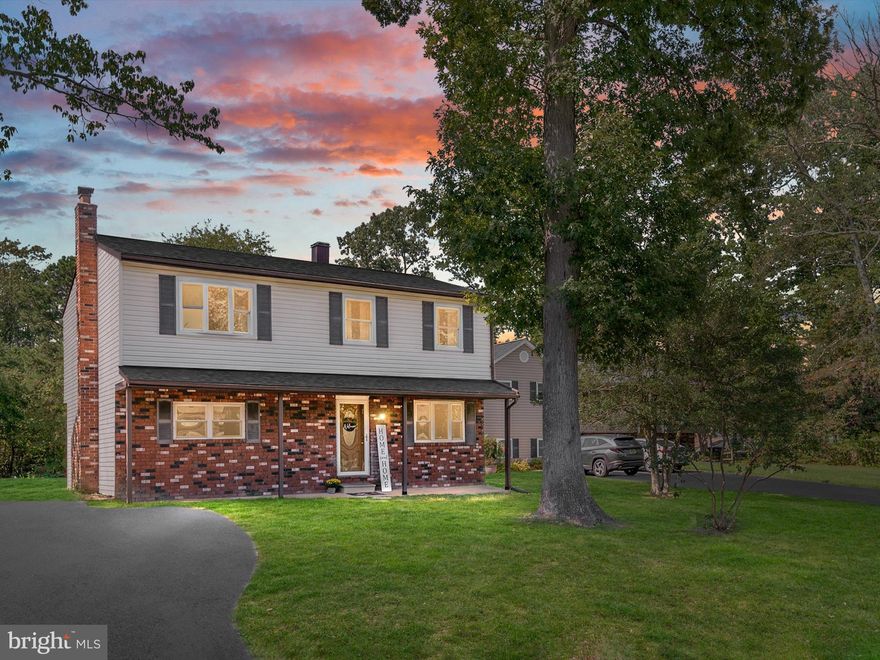 Move-in ready Colonial located in the highly sought-after Chelsea Beach community. This home features 4 bedrooms, 2.5 baths, and sits on a spacious 1/2 acre lot backed by serene woods. The interior boasts brand-new carpet and flooring throughout, along with a modern kitchen featuring new cabinets and granite countertops. Enjoy cozy evenings by the fireplace in the family room. The primary bedroom includes a walk-in closet and a private en-suite bathroom, while three additional spacious bedrooms and a 2nd full bath are located upstairs. The main level offers a separate dining area, formal living room, and a convenient powder room.  Basement has a walkout and is perfect for a ton of storage! Situated on a quiet dead-end street, this home provides both privacy and a peaceful setting. Community offers tot lots/playground, boat ramp, nature trails and much more!  Close proximity to schools, shopping,  restaurants, Annapolis, and all express ways!