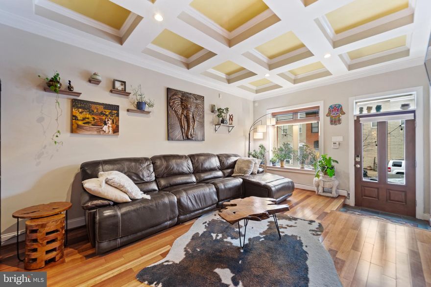 Welcome to 1009 S Clinton Street and experience city living at its finest! This renovated 3-bedroom, 2.5-bath rowhome boasts over 3,000 finished sqft and an oversized garage! Upon entering, you'll be greeted by a spacious, open living area that seamlessly connects to a gourmet kitchen featuring, stainless steel appliances, granite countertops, a wine fridge, and a large island. The main level also offers a separate dining space, a half bath, and an entrance to your rear garage. Moving to the second floor, you'll find two large bedrooms adorned with gleaming hardwood flooring and massive walk-in closets with custom shelving. Convenience is key with laundry located on the second floor. Ascend to the third floor, and you'll discover the luxurious primary bedroom suite and primary bath with a large shower and soaking tub. The primary bedroom features a gas fireplace and a walk-in custom closet. Make your way past the wet bar to an expansive 2-tiered rooftop deck featuring some of the best panoramic city views Canton has to offer! The lower level offers a spacious bonus living area and a finished-out storage area with cabinets and shelving. This home is just a short walk away from all of the stores and shops in Canton Crossing, Canton Square's restaurants and bars, Canton Waterfront Park, and easy access to I-95
