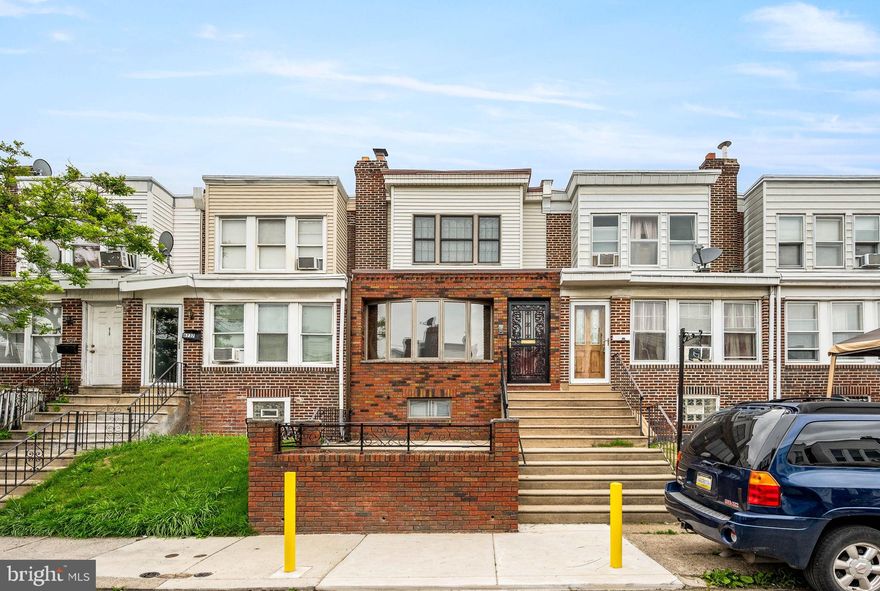 Welcome to this beautifully remodeled 3-bedroom, 1 bath large row home in the heart of Southwest Philadelphia, where modern upgrades meet timeless charm. From the moment you arrive, you’ll be impressed by the home's classic brick façade, elegant bow window, and inviting raised concrete patio—perfect for relaxing with morning coffee or evening conversation.

Step inside to find gleaming, refinished original hardwood floors that flow seamlessly through the spacious living room and formal dining room. The sun-drenched interior is enhanced by black-framed windows that add a stylish contrast and flood the home with natural light.

The updated eat-in kitchen is a showstopper, featuring crisp white shaker cabinets, large subway tile backsplash, striking black quartz countertops, and charming wainscoting detail—ideal for both cooking and entertaining.

Upstairs, you'll find three generously sized bedrooms, each with ample closet space and beautiful natural light. The finished basement offers additional living space, perfect for a home office, gym, or playroom, and includes a washer/dryer, convenient access to the garage and extra parking out back.

With thoughtful upgrades throughout and exceptional curb appeal, this home is move-in ready and waiting for its next chapter. Don’t miss your chance to own this gem in one of Southwest Philly’s most established neighborhoods!

Located just down the street from Finnigan Playground, offering access to a public pool, basketball courts, baseball fields, hockey rink, and playground—perfect for outdoor recreation and community enjoyment

This home may be eligible for free down payment assistance. Ask me how!