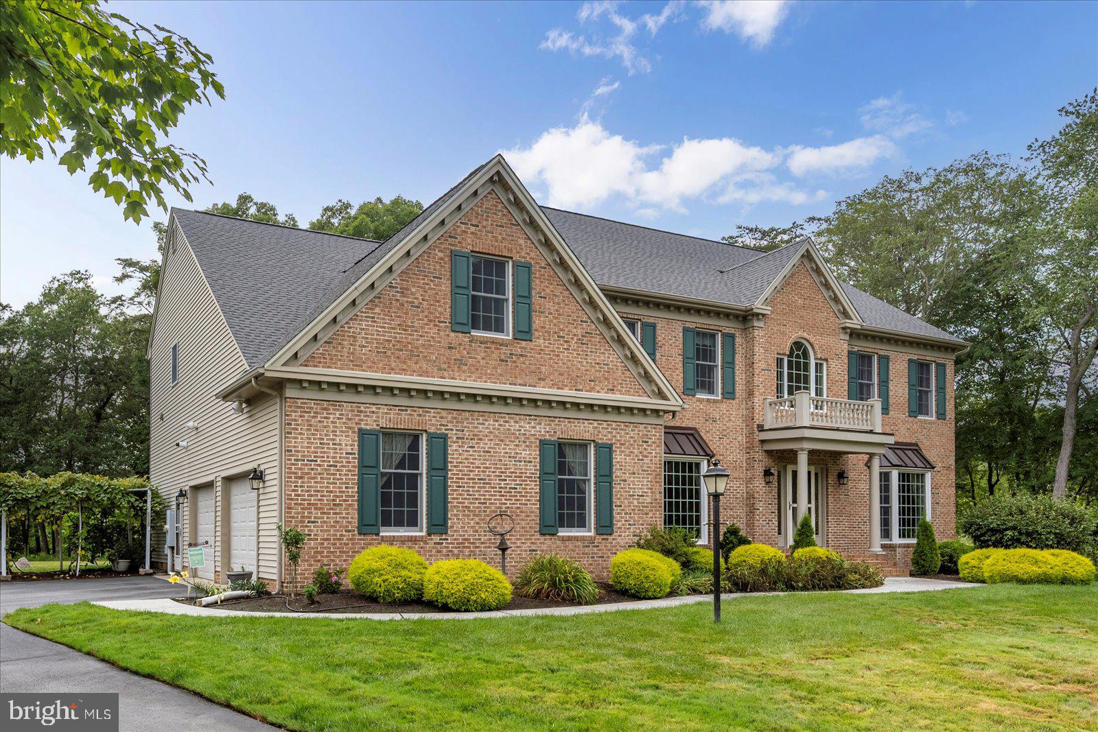 Sited within a quiet cul-de-sac on 3.07 acres in stately Kensington Woods, this 4269 SF, 4 bedroom, 4 full bath residence offers the perfect setting for gracious living and entertaining. Comfortable and inviting with spacious rooms throughout, the home's main level features a dramatic 2-story foyer, formal living room and dining room, and a delightful eat-in kitchen w/ a gas fireplace that serves the family room, as well. The 1st floor also offers a convenient home office with room for 2 desks, and with its close proximity to the full bath, it could be set up to serve as a bedroom for guests. The hardwood staircase leads to a relaxing primary suite with lighted tray ceiling, ample closet space, and an updated bathroom (2023) w/ heated floor, double bowl vanity, jetted tub and more. Another large bedroom boasts its own private bath, and the 3rd and 4th bedrooms are served by the hall bathroom. Other 2nd floor features include stairway access to the floored attic, a bonus room w/ bookcases, and a convenient laundry room. Enjoy gardening? You'll love the fruit trees...fig, plum, apple, etc., the 6 raised garden beds ready for your plantings, and the trellis adorned with grape vines. A garden shed will hold all your tools, and you can enjoy viewing your own secret garden with a natural tree backdrop from the spacious patio off the family room and the 3-season porch accessed from the kitchen. Other features include in ground irrigation, an asphalt driveway leading to the 2-car garage, encapsulated crawl space, replaced roof (2024), replaced water treatment system (2024), and a replaced septic system (2021).