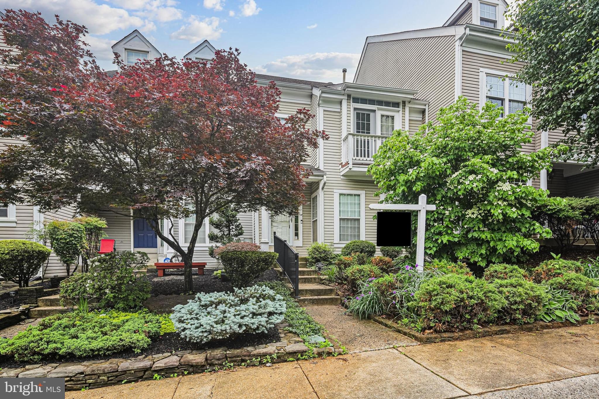 This beautifully maintained 3 bedroom, 2.5 bath townhome offers the perfect blend of comfort and convenience. The main level features a bright sunroom and dining area with a stunning double-sided fireplace, creating a warm and inviting atmosphere. Step out onto the private deck overlooking a fenced backyard that backs to a peaceful common area—perfect for outdoor gatherings or quiet evenings. Basement level is a walk-out fully finished for additional living space. Conveniently located near shopping, restaurants, and more!
