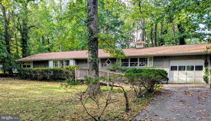 Rambler with 3 bedrooms and 2 baths. 3 acres of privacy located in the Town Creek neighborhood close shopping and the Patuxent River Naval Air Station.  NO HOA . Sold As-Is.