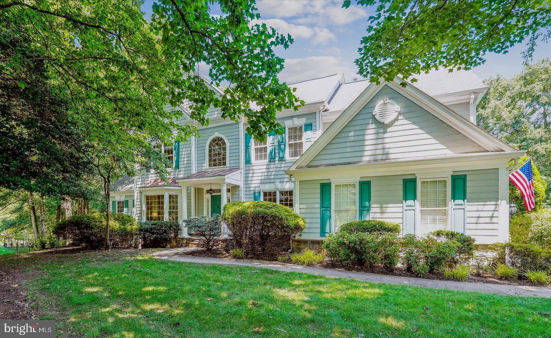Breathtaking Pulte-built Hampton II model on the perfect .89 Acre corner lot in the heart of Oakton, the sought-after neighborhood of Wheatland Farms. Curb appeal to the max! Walk to Difficult Run Trails from this stunning 5 Bedroom, 4.5 Bath home, offering approximately 7,350 square feet of light-infused space. In addition to 4 upper-level bedrooms, this thoughtfully designed home even offers an Au Pair or in-law suite with a Living Room, Bedroom and Full Bath in the full daylight walk-out lower level. The welcoming columned Portico ushers you into the two-story foyer with marble flooring. It's flanked by the Living Room and formal Dining Room, both sharing hardwood floors and elegant architectural detailing. The Living Room features a charming bay window overlooking the front garden, while the Dining Room presents Crown Dentil Molding, Wainscoting and an exquisite ceiling medallion. The perfect space to host your next dinner party! The Conservatory, off the Living Room through French doors, is breathtaking. It features a cathedral ceiling and wooded views through 3 windowed walls. Then, at the heart of the main level, sits the two-story Great Room, with soaring windows and a floor-to-ceiling stone Gas Fireplace. It is absolutely wide open to the Kitchen and Breakfast Room. You will love the open concept floorplan of these rooms! The Kitchen is an epicurean’s delight, with GE double Wall ovens, a KitchenAid dishwasher and refrigerator, and an abundance of Maple Cabinetry. A large central island with granite countertop offers plenty of workspace and a 5-burner GE Monogram gas cooktop. A walk-in Pantry provides additional storage, while a Kitchen desk provides convenient workspace. It's open to a large Breakfast Room and provides access to the no-maintenance Deck overlooking the fenced backyard. It also enjoys access to the Mudroom and Laundry Room. A main level Study features a gracious bay window overlooking the backyard. It offers a wall of Built-ins as well as Crown Molding. A guest Powder Room completes the main level. The Upper level offers 4 large Bedrooms, including a spectacular Owner's Retreat. It features a deep tray ceiling with molding and a sitting area with a romantic Gas fireplace with built-in bookcase surround. It also opens to a luxurious Primary Bath with 2 Vanities, a walk-in Shower, a separate soaking tub and a private water closet. It also offers a spacious walk-in closet. There are 3 generously proportioned ancillary Bedrooms... one enjoys a private bath while 2 share a Jack 'n Jill Bath. The upper-level landing presents dramatic views of the Foyer and Great Room. The expansive full daylight lower level offers seemingly endless space and can easily accommodate multi-generational living. There is a Family Room with Gas Fireplace that enjoys access to the patio and yard beyond, a Recreation Room (with rough-in for a Wet Bar), a Game Room, and Den/Storage Room. … But, wait for this! A large Au Pair or In-Law Suite offers a Living Room, Bedroom and Full Bath. This is the ideal flex space to use to suit your family's needs! Outdoors, you'll find an enormous, fenced Backyard, a Deck, Patio and a Playset for the kids. Beautiful mature trees provide dappled shade around the yard. The 2-car garage offers an EV charging station and there is plenty of space for additional parking in the driveway. Updates include: Hardwood floor Kit & Breakfast Rm 2025; Central Vac 2025; Main & Upper HVAC 2024; EV charger 2022; Fence 2022; Water Htr 2022; LL carpet 2022; Roof 2015; Conservatory HVAC 2009. All of this --- just minutes away from Fairfax Corner, Vienna Metro, Tysons, Reston and major commuter routes. Walk to Difficult Run trails! Oakton High School Pyramid.
