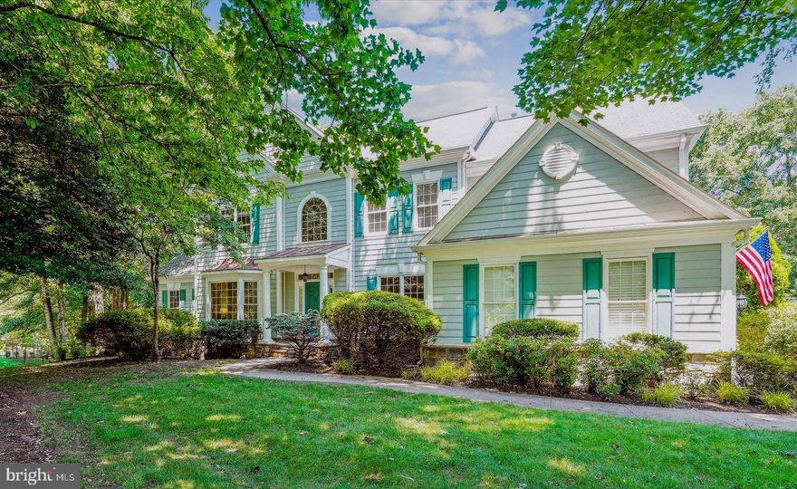 PRICE REDUCED!!!  INCREDIBLE VALUE!  Breathtaking Pulte-built Hampton II model on the perfect .89 Acre corner lot in the heart of Oakton, the sought-after neighborhood of Wheatland Farms. Curb appeal to the max! Walk to Difficult Run Trails from this stunning 5 Bedroom, 4.5 Bath home, offering approximately 7,350 square feet of light-infused space. In addition to 4 upper-level bedrooms, this thoughtfully designed home even offers an Au Pair or in-law suite with a Living Room, Bedroom and Full Bath in the full daylight walk-out lower level.  The welcoming columned Portico ushers you into the two-story foyer with marble flooring. It's flanked by the Living Room and formal Dining Room, both sharing hardwood floors and elegant architectural detailing. The Living Room features a charming bay window overlooking the front garden, while the Dining Room presents Crown Dentil Molding, Wainscoting and an exquisite ceiling medallion. The perfect space to host your next dinner party!  The Conservatory, off the Living Room through French doors, is breathtaking. It features a cathedral ceiling and wooded views through 3 windowed walls. Then, at the heart of the main level, sits the two-story Great Room, with soaring windows and a floor-to-ceiling stone Gas Fireplace. It is absolutely wide open to the Kitchen and Breakfast Room. You will love the open concept floorplan of these rooms! The Kitchen is an epicurean’s delight, with GE double Wall ovens, a KitchenAid dishwasher and refrigerator, and an abundance of Maple Cabinetry. A large central island with granite countertop offers plenty of workspace and a 5-burner GE Monogram gas cooktop. A walk-in Pantry provides additional storage, while a Kitchen desk provides convenient workspace. It's open to a large Breakfast Room and provides access to the no-maintenance Deck overlooking the fenced backyard.  It also enjoys access to the Mudroom and Laundry Room. A main level Study features a gracious bay window overlooking the backyard. It offers a wall of Built-ins as well as Crown Molding. A guest Powder Room completes the main level. The Upper level offers 4 large Bedrooms, including a spectacular Owner's Retreat. It features a deep tray ceiling with molding and a sitting area with a romantic Gas fireplace with built-in bookcase surround. It also opens to a luxurious Primary Bath with 2 Vanities, a walk-in Shower, a separate soaking tub and a private water closet. It also offers a spacious walk-in closet. There are 3 generously proportioned ancillary Bedrooms... one enjoys a private bath while 2 share a Jack 'n Jill Bath. The upper-level landing presents dramatic views of the Foyer and Great Room. The expansive full daylight lower level offers seemingly endless space and can easily accommodate multi-generational living. There is a Family Room with Gas Fireplace that enjoys access to the patio and yard beyond, a Recreation Room (with rough-in for a Wet Bar), a Game Room, and Den/Storage Room. … But, wait for this!  A large Au Pair or In-Law Suite offers a Living Room, Bedroom and Full Bath. This is the ideal flex space to use to suit your family's needs! Outdoors, you'll find an enormous, fenced Backyard, a Deck, Patio and a Playset for the kids. Beautiful mature trees provide dappled shade around the yard. The 2-car garage offers an EV charging station and there is plenty of space for additional parking in the driveway.  Updates include: Hardwood floor Kit & Breakfast Rm 2025; Central Vac 2025; Main & Upper HVAC 2024; EV charger 2022; Fence 2022; Water Htr 2022; LL carpet 2022; Roof 2015; Conservatory HVAC 2009. All of this --- just minutes away from Fairfax Corner, Vienna Metro, Tysons, Reston and major commuter routes. Walk to Difficult Run trails!  Oakton High School Pyramid. AS-IS.  THIS IS A ROCK-BOTTOM PRICE.