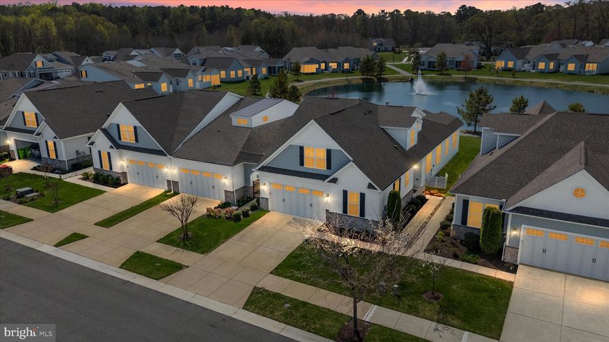 Welcome to Bay Bridge Cove, Kent Island’s premier 55+ community, the Gateway to Maryland’s Eastern Shore. This popular Laurel model, is one of the largest homes in the community, offering over 2,800 sq. ft. of open, living space in a desirable end-unit that backs to one of the community’s scenic ponds and walking/jogging paths.

The main level features a bright, open floor plan with 9-foot ceilings, luxury vinyl plank flooring, and plantation shutters throughout. Enjoy a spacious living room with a gas fireplace that opens to the kitchen and dining area, and a 12X8 extension adding more space, windows and natural light. The modern kitchen includes a quartz island and energy-efficient appliances. One of the outstanding features of this home is the oversized primary bedroom suite with a sitting room overlooking the pond. An additional bedroom for guests completes this home’s main level.

Upstairs, a loft, third bedroom, and full bath provide additional flexible space for guests or a home office. The home also includes a two-car garage, a separate laundry room, and ample off-street parking for visitors.

Residents enjoy resort-style amenities at the Bay Bridge Cove clubhouse, complete with a swimming pool, fitness center, library, game, meeting, and crafts rooms, plus bocce ball, tennis, and pickle ball courts. Ideally located just 15 minutes to Annapolis, 40 minutes to BWI, and about 1.5 hours to the Delaware beaches, this home offers the perfect blend of coastal charm, convenience, and active living.