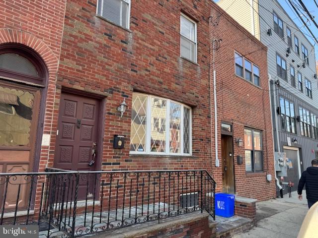 Newer brick front, Spacious living room, dining room, Large eat-in kitchen, Powder room on the first floor with large rear yard. Finished basement with powder room, all good systems. The second-floor has a wide oak staircase, three large bedrooms, a large tile bathroom, and many closets. This home is in the Italian market area, within walking distance to Center city, Washington Ave, Shopping, restaurants, etc....