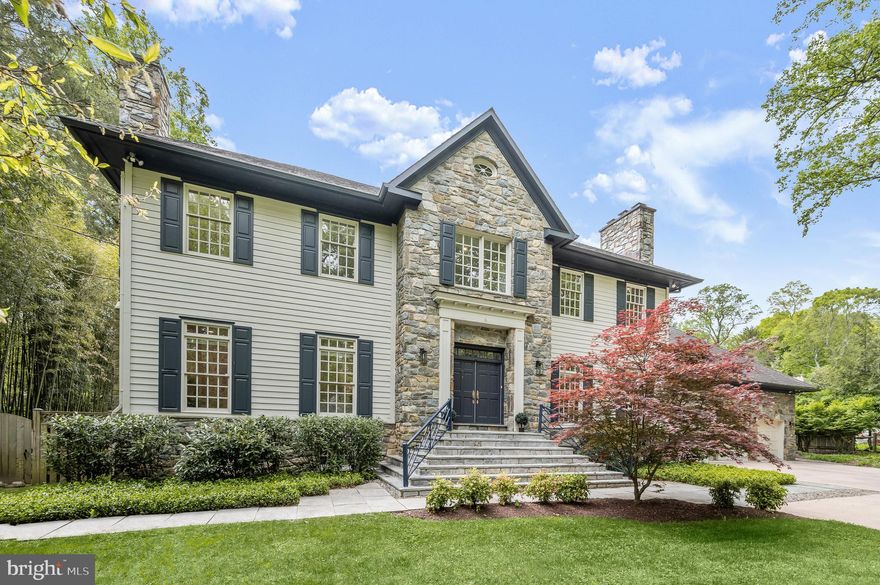 Located on the quiet side of Greentree and tucked away behind a row of evergreens in the heart of highly sought-after Bradley Hills Grove is this handsome Georgian Colonial estate. Sited on over ½ an acre of beautifully planted grounds with an inviting 40-foot pool, this property makes an inviting and dramatic first impression.  Originally custom-built by award-winning Jeffco Builders, the home exudes timeless elegance.  Artistic in the way it flows in, natural light bathes the home in a warm glow. Highly dramatic in nature, the two-story family room with 30’ cathedral ceilings and substantial stone fireplace are simultaneously awe-inspiring and welcoming.  The embassy sized living and dining room with wood burning fireplaces are more than ample for grand-scale entertaining and the sleek chef’s kitchen is a delight for culinary endeavors.  Tucked out of the way is a lovely wood-paneled office with French doors leading to the terrace overlooking the pool and the expansive green lawn.  Adding to this spectacular main level is a fabulous mud room with full bathroom to service the pool and a 3-car garage with 12’ ceilings and tons and tons of storage space!  Upstairs the sumptuous primary bedroom with its own fireplace and enough room for additional seating leads to a gorgeous bath with floating tub and large shower.  Three additional generous bedrooms and 2 beautifully renovated bathrooms compliment the upper level. The lower level boasts a large recreation room with stone fireplace, several additional spaces for work or play, convenient kitchenette, large bedroom with ensuite bathroom and an enormous amount of storage.  Outside, the sprawling verdant lawns are surrounded by mature foliage for total privacy. Timeless design, artfully restrained interiors, and a central location close to parks, trails, shops and more make 6710 Greentree the epitome of luxury living.