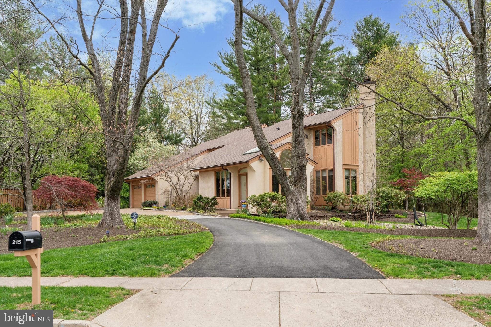 Meticulously maintained with beautiful curb appeal, this incredible home can be found in one of Upper Gwynedd's most desirable locations. With a unique floor plan that includes a thoughtfully and carefully designed main floor space with a separate entrance, this Billy Jay Hoffman designed home has been lovingly maintained by the original owners for over 40 years. A new driveway complemented by brick and Belgian block welcomes you to this impressive property highlighted by gorgeous specimen plantings and landscaping around the entire home. The contemporary exterior offers a more traditional floorplan as you enter through a custom double front door into the dramatic two-story foyer. As you tour the entire home, you will be struck by the many windows that essentially bring the outside in and provide stunning views from each room. The living room and dining room are both quite spacious and will certainly enhance your year-round entertaining. The island kitchen offers abundant cabinetry, granite counters, double sink, Thermador gas cooktop, GE double oven and microwave, SubZero refrigerator, Bosch dishwasher and small storage closet. The cozy, sun-drenched breakfast room with organized pantry, built-in desk, banquette seating and skylights offers a serene spot to enjoy your morning coffee. Spend chilly evenings by the gas fireplace in the family room with handsome built-ins. The sellers use the bonus space on the main floor as a professional office. With a separate entrance that seamlessly blends into the facade of the home and offering an accommodating floor plan for most any use including a main floor bedroom, in-law or au pair suite, you'll find great closet and storage space, a sunny, separate sitting area and an updated full bath with a stall shower. Looking to relax after a long day? Just head upstairs to the primary suite and find your perfect retreat. With two big walk-in closets, custom vanity and a gorgeous primary bath that boasts a soaking tub, skylights, beautiful ivory cabinets, dual bowl vanity, linen closet and designer ceramic tile, you will surely never want to leave. Two generously sized bedrooms, one with an entrance to the hall bath, laundry room and huge storage closet round out the upper level. The second bedroom walk-in closet provides access to even more storage over the garage. The covered patio and rear deck provide peaceful and tranquil spaces to enjoy the beauty that surrounds you at this property. The setting is simply superb. Additional assets include three-zone HVAC all replaced in the last five years, new roof and skylights in 2020, exterior (windows, doors and wood decorative trim) of home painted in 2023, new gutters with leaf guard installed in 2023, custom blinds and recessed lighting throughout, updated bathrooms, upgraded Berber carpet, closet organizers, oversized two car attached garage with extra storage area, rear yard storage shed, security system and the list goes on. This is truly an extraordinary property that will be a very special place to call home. Close to shopping, the R5 train line to Center City and the beautiful trails, nature and open space of the Gwynedd Wildlife Preserve and the Wissahickon Valley Watershed, this one-of-a kind property awaits the most discriminating buyer.