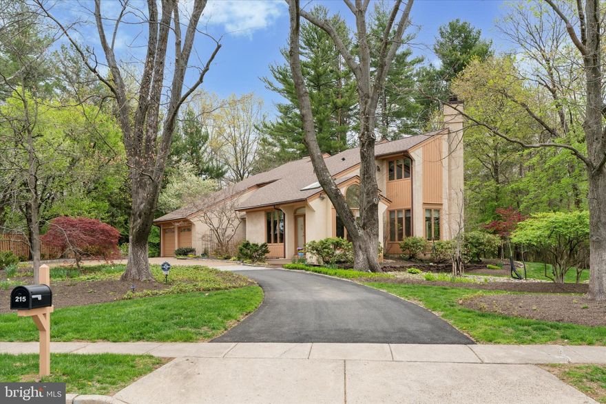 Meticulously maintained with beautiful curb appeal, this incredible home can be found in one of Upper Gwynedd's most desirable locations.  With a unique floor plan that includes a thoughtfully and carefully designed main floor space with a separate entrance, this Billy Jay Hoffman designed home has been lovingly maintained by the original owners for over 40 years.   A new driveway complemented by brick and Belgian block welcomes you to this impressive property highlighted by gorgeous specimen plantings and landscaping around the entire home. The contemporary exterior offers a more traditional floorplan as you enter through a custom double front door into the dramatic two-story foyer.  As you tour the entire home, you will be struck by the many windows that essentially bring the outside in and provide stunning views from each room.  The living room and dining room are both quite spacious and will certainly enhance your year-round entertaining.  The island kitchen offers abundant cabinetry, granite counters, double sink, Thermador gas cooktop, GE double oven and microwave, SubZero refrigerator, Bosch dishwasher and small storage closet.  The cozy, sun-drenched breakfast room with organized pantry, built-in desk, banquette seating and skylights offers a serene spot to enjoy your morning coffee.  Spend chilly evenings by the gas fireplace in the family room with handsome built-ins.   The sellers use the bonus space on the main floor as a professional office.  With a separate entrance that seamlessly blends into the facade of the home and offering an accommodating floor plan for most any use including a main floor bedroom,  in-law or au pair suite,  you'll find great closet and storage space, a sunny, separate sitting area and an updated full bath with a stall shower.  Looking to relax after a long day?  Just head upstairs to the primary suite and find your perfect retreat.  With two big walk-in closets, custom  vanity and a gorgeous primary bath that boasts a soaking tub, skylights, beautiful ivory cabinets, dual bowl vanity, linen closet and designer ceramic tile, you will surely never want to leave.   Two generously sized bedrooms, one with an entrance to the hall bath, laundry room and huge storage closet round out the upper level.  The second bedroom walk-in closet provides access to even more storage over the garage.   The covered patio and rear deck provide peaceful and tranquil spaces to enjoy the beauty that surrounds you at this property.   The setting is simply superb.  Additional assets include three-zone HVAC all replaced in the last five years, new roof and skylights in 2020, exterior (windows, doors and wood decorative trim)  of home painted in 2023, new gutters with leaf guard installed in 2023,  custom blinds and recessed lighting throughout, updated bathrooms, upgraded Berber carpet, closet organizers, oversized two car attached garage with extra storage area, rear yard storage shed, security system and the list goes on.  This is truly an extraordinary property that will be a very special place to call home.   Close to shopping, the R5 train line to Center City and the beautiful trails, nature and open space of the Gwynedd Wildlife Preserve and the Wissahickon Valley Watershed, this one-of-a kind property awaits the most discriminating buyer.