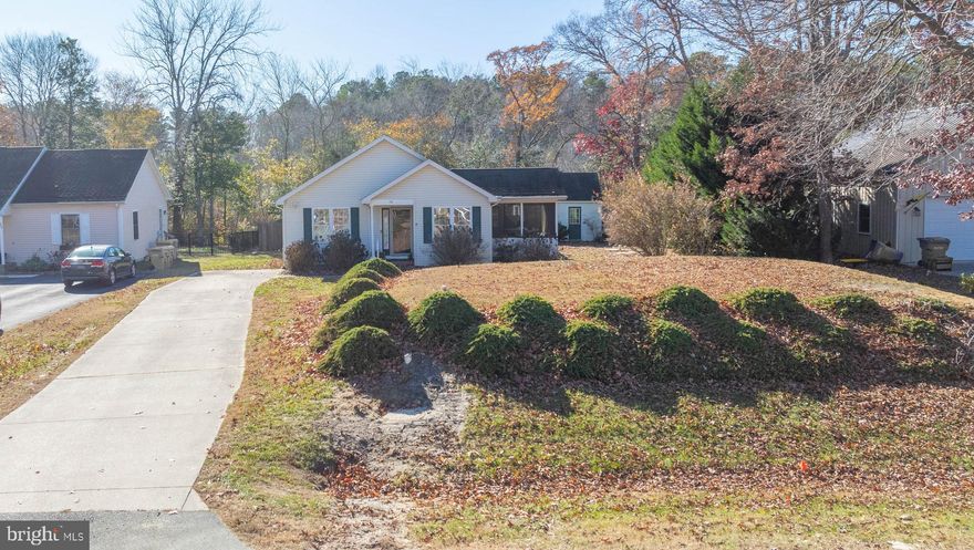 This adorable 3 bedroom, 2 bath cottage style home located in the community of Lochwood in Lewes is ready for you to move in and enjoy all that Lochwood has to offer. Lochwood is a lovely wooded and safe community sitting on 109 acres of land bordering Burton Pond.  Located just 5 miles from Coastal Highway, you will enjoy easy access to both Cape Henlopen State Park beaches in Lewes and Rehoboth Beach.  Shopping is readily available in nearby Long Neck, as well as Lewes and Rehoboth.  Sited on a .25 acre lot, the property features 2 storage sheds, a screened-in porch, vaulted ceiling in the main living area and LVP flooring throughout this one level home.  If you're looking for easy living in a great location, this home offers all of that and more.  FYI-Public sewer is being installed throughout the community, the connections are scheduled to be completed before Summer 2025.  Cost for the connection is being paid by the seller (will be escrowed at closing if not due until after the closing.)