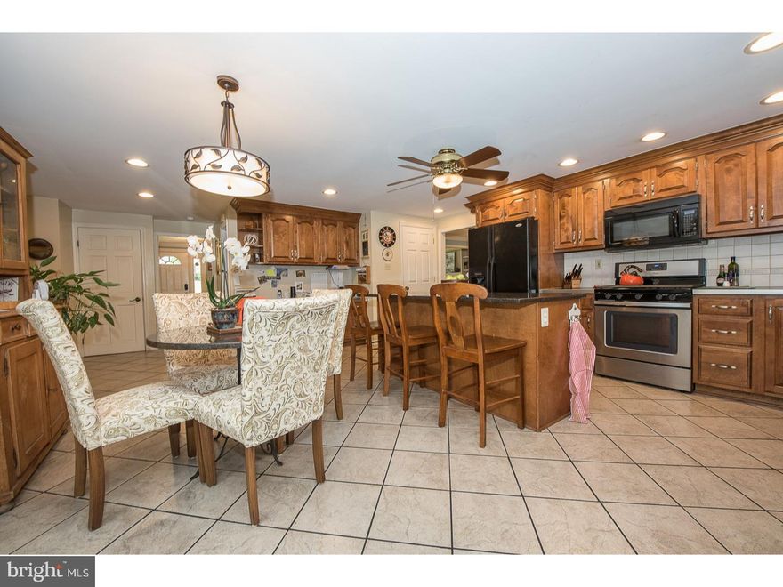 Delightful five Bedroom Center Hall Colonial with a gorgeous in-ground pool in the heart of Wallingford Swarthmore School District. Charm and surprises throughout! Enter the front door to a tiled foyer with wainscoting and crown molding ? which continues up the stairs and throughout the Living Room and Dining Room.  The sprawling Living Room is just off the Foyer and features two sets of pocket doors plus a lovely gas fireplace and built-in shelving. There is hardwood flooring throughout much of the first floor and all of the second floor. There is a GIGANTIC Kitchen located at the back of the house with French doors that open to a glorious deck and in-ground heated pool(with attached hot tub!) ? a slice of paradise!  Kitchen features new 5 burner gas stove and large walk-in pantry. Family Room flows nicely off the Kitchen and offers another gas fireplace and an exit to the attached two car garage. Upstairs you'll find five roomy Bedrooms, including a Master with an ensuite Bath and another very over-sized Bedroom ? it boasts a cathedral ceiling and sky-light (so many possibilities for this room!). The Basement is finished and provides lots of multi-purpose space.  There is room for a Den or Office plus a Laundry Room (new washer/dryer) ? and for your inner drummer: a fabulous SOUND PROOF room (currently used as a Music Room!).  The House also includes a custom shed tucked away in the backyard, fenced in yard, and amazing landscaping including Cherry Tree, Dogwoods, Wisteria and roses.  Wallingford Swarthmore School District is a top Philadelphia area school district and several of its schools have been awarded "Blue Ribbons" from the U.S. Department of Education. Additionally, Strath Haven High School has been named one of "America's Outstanding High Schools" by US News & World Report and Newsweek Magazine -- and fields the LARGEST MARCHING BAND in the state of Pennsylvania!