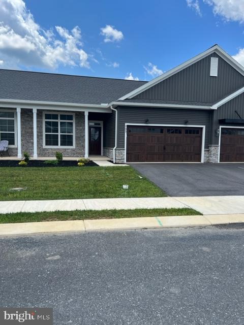 55+ community,  $30,000+ EQUITY!!!  Brand new home!!! Built and ready to move-in!! Only 3 months old, this ranch home located in Cortland Park has vinyl plank flooring throughout. The two car garage, with garage door opener, leads to a mud room area with storage and access to the laundry room and attic.  The beautiful gray kitchen cabinets are accented with stainless steel appliances while the lighting highlights the gorgeous quartz counters.  The kitchen island provides additional seating while housing the sink and dishwasher.  When entertaining , the open floor plans allows for the cook to see everything in the dining and living areas.  The sliding glass doors, that lead to the patio, coupled with the tall windows, bring in plenty of natural light for the 10 ft. high ceiling.  The master bath has doubled bowled sink, 5 ft. shower, and large walk-in shower while another bedroom and full bath are available  for guest.