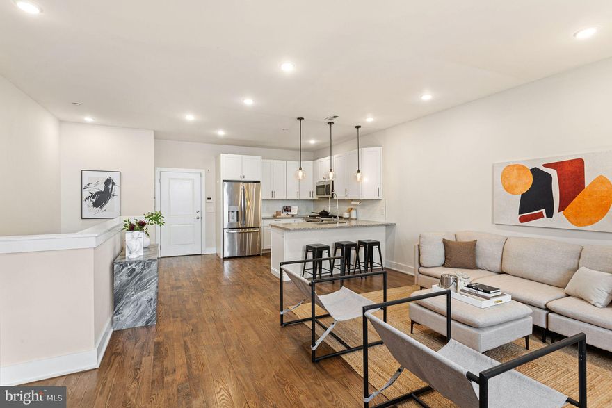 Newer construction, low maintenance condo with two bedrooms and two full bathrooms in Fishtown, one of Philly’s hottest neighborhoods! Step inside to discover beautiful hardwood floors that flow seamlessly through the open-concept living spaces, complemented by recessed lighting that creates a warm and inviting ambiance. The bright and airy layout leads to an impressive open kitchen, fully equipped with stainless steel appliances, ample counter and cabinet space, pendent lighting and tiled backsplash, all perfectly suited for cooking and entertaining. The spacious primary bedroom features an ensuite bathroom with a stall shower, providing a private sanctuary for relaxation. The second bedroom offers flexibility, whether for guests, an office, or additional living space and a large closet. An additional custom designed full bathroom with a tub completes this floor. Low condo fees, tax abatement remaining, central heating and cooling, in-unit washer and dryer. Great Fishtown location. Quick walk to Frankford Ave with some of the best restaurants the city has to offer. Just steps from Penn Treaty Park and the recently upgraded Delaware River Trail. Just blocks from the Girard Ave Station and only a 10-minute ride to Center City, plus easy access to I-95.