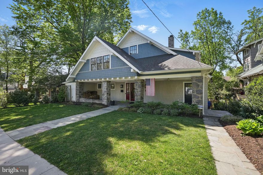 Welcome to 3212 Oliver St. NW, a beautifully expanded and renovated home (2019) on a generous 10,000-square-foot lot, just half a block from Lafayette School and Lafayette-Pointer Park. This elegant residence blends modern luxury with timeless charm across three thoughtfully designed levels. The home begins with a wide, step-free stone entry porch and a custom front door with sidelights, leading into an elegant foyer. At the heart of the main level is a striking family room with soaring beamed ceilings, a four-panel accordion door with transom windows overlooking the backyard, custom built-ins, and an oversized wood-burning fireplace with Fireclay tile surround and salvaged barn beam mantel. The sunlit kitchen features three exposures, a large island with seating for five, custom cabinetry, a built-in GE refrigerator, two paneled dishwashers, a 48” dual-oven Viking range with griddle, two pantries, and a raised bar with accordion window opening to the screened porch. The impressive screened porch has a vaulted ceiling and is ideal for dining or lounging, with direct access to a sun deck that connects seamlessly to the living room, kitchen, office, and backyard. The main level also includes a formal dining room with custom built-ins and a wallpapered ceiling, a cozy lounge with six windows, wet bar, ice maker, beverage fridge, and a 650+ bottle custom walk-in wine room, a private office, a guest bedroom, a full bath with soaking tub, a cheerful mudroom with storage and separate entrance, and a guest coat closet. Upstairs, the primary suite features a wood-paneled vaulted ceiling, two walk-in closets, and a spa-like bath with skylight. A second bedroom offers dual closets and an en-suite bath, while two additional bedrooms share a hall bathroom with dual vanities. The upper level also includes a laundry room, three large storage attics, and a spacious hallway with volume ceilings. The lower level includes a sixth bedroom, fifth full bathroom, two large recreation rooms with walk-out access to a rear entertaining patio, a gym, oversized kitchenette, second laundry room, utility and storage rooms. Outside, enjoy a fully fenced, newly sodded flat backyard, a flagstone path connecting front and rear yards, a storage shed, gas line for grilling, and dedicated trash can storage. Extensively renovated in 2019, the home features a hidden laundry chute, whole-house water softener, tankless gas water heater, full exterior foam insulation, built-in Sonos sound system, Hardy Plank siding, Pella wood-clad aluminum windows, and a security system with cameras. HVAC includes electric heat pumps for upper levels and gas furnace with electric AC for main and lower levels.  WhisperKool split cooling system in wine room. Additional upgrades include 6” gutters, new drainage lines, keyless entry, and remote-control window coverings. Located just 1/2 block from Lafayette-Pointer Park and a quick walk to Rock Creek Park, Broad Branch Market, and popular restaurants like Comet Ping Pong and Call Your Mother Deli, this home offers exceptional walkability and access to nature. It is served by top-rated public schools (Lafayette Elementary, Deal Middle, and Jackson-Reed High) and near several nursery and private schools, including Blessed Sacrament and St. John’s College High School.  There are several options for off-street parking and car charging including the original attached garage!