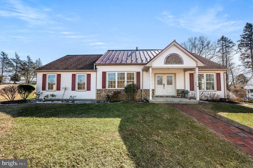OPEN HOUSE THIS SATURDAY 3/15 11AM-1PM! If you've been searching for the perfect blend of comfort, charm, and countryside serenity—look no further! This custom-built 3-bedroom rancher sits on 1 acre of pure possibility and comes with an oversized two-car garage (so big, you could easily turn it into a three-car!). Built in 2012, this thoughtfully designed home offers true one-floor living with an effortless flow that makes everyday life feel like a breeze. From the moment you step inside, you’ll be wowed by the vaulted ceiling accented with rustic wood and an antique beam, giving the home a cozy yet sophisticated touch. The large windows flood the space with natural light, making the rich hardwood floors shine from room to room. Now, let’s talk about the kitchen—because let’s be honest, it’s the heart of the home! Featuring sleek countertops, beadboard cabinet fronts, soft close cabinets/drawers, stainless steel appliances (yes, there's a secondary wall oven!), a walk-pantry closet, and a center island, this kitchen is built for both function and style. The open-concept great room is where the magic happens, complete with a stone-surround gas fireplace on one side and a woodstove hookup on the other - so no matter the season, your nights will always be warm and cozy. With breakfast, dining, and living areas all flowing together, you have endless opportunities to design your dream space. Need a spot to soak in the fresh air? The breakfast area opens to a fantastic pavilion, the perfect place to enjoy your morning coffee, entertain guests, or simply take in those stunning farmland sunsets. When it’s time to unwind, the primary suite is your personal retreat, featuring a huge walk-in closet with pocket door and an en-suite bathroom with a 5-foot tiled walk-in shower and double linen closet. The second bedroom is extra special with its own powder room and a spacious walk-in cedar closet, while the third bedroom makes the ideal home office or cozy guest space. Let’s not forget the massive, dry basement! With poured superior concrete walls, it’s already studded out and ready to be finished—whether you dream of a home gym, media room, extra living space, or just need storage for every holiday decoration you’ve ever owned. The home is wired for a whole house generator too! And the garage? It’s ABSOLUTELY AWESOME - deep, oversized, and packed with potential. Plus, there’s an 8x10 storage shed just in case you need even more room! Nestled in charming Elverson, this home offers the best of peaceful rural living while keeping you minutes from Saint Peters Village and Hopewell National Park. Need to commute? You’re just a short drive to Rt. 23 and the PA Turnpike for easy access wherever you need to go. This home is one-of-a-kind, move-in ready, and waiting for you to make it your own. Schedule your private showing today and let’s turn your countryside living dream into a reality!