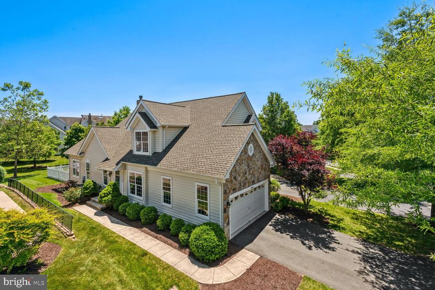 Fabulous End Unit Carriage-Style Townhome in Belmont Country Club! This Very Popular Rockland Model is Filled with Light and Features the Sunroom Addition! Cathedral Ceilings in the Living Room, Sunroom and Primary Bedroom!  Large Family Room w/ Gas Fireplace and Built-In Bookshelves!  Gourmet Kitchen w/ Granite Countertops and Upgraded Cabinets!  New Carpet and Paint Throughout!  New Light Fixtures!  Large, Flat Fenced Backyard that Backs to Common Area.  Great Central Location within Belmont Country Club!  Resort Style Community & Amenities!