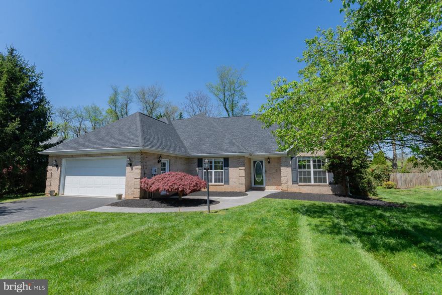 Welcome to your dream home nestled in the sought-after Locust Hill Subdivision! This contemporary brick-front beauty boasts an impressive 2394 square feet of finished living space spread across two levels, promising the epitome of modern comfort and style.  Step inside and be greeted by an abundance of natural light gleaming through the open layout of the main level, adorned with vaulted ceilings that create an airy and inviting atmosphere. Prepare culinary delights in the gourmet kitchen, where quartz countertops, hardwood flooring, a built-in microwave, and a gas cooking stove await your culinary creations.
Host elegant dinner parties in the formal dining room, resplendent with its gleaming hardwood floors, or unwind by the two-sided gas fireplace that seamlessly connects the family and living rooms, setting the perfect ambiance for cozy evenings in.  Retreat to the luxurious main level owner's suite, featuring tray ceilings, a sliding door leading to the deck, and an attached spa-like bath complete with dual vanities, a jetted soaking tub, and a separate shower.   Upstairs, discover two generously sized bedrooms sharing a full bath, with the third bedroom offering a versatile extended bonus room, ideal for storage or customizable to suit your lifestyle—be it a playroom, office, man cave, or craft room, the possibilities are endless!  With a 2-car attached garage and driveway providing ample parking space, convenience is at your doorstep. Step outside to the fenced rear yard, where serenity awaits.  Perfect for unwinding or entertaining on the spacious deck or screened porch.  Embrace the leisurely lifestyle of Locust Hill, a golf course community that offers not just a home, but a haven. Don't miss your chance to make this gem your own—schedule your showing today.