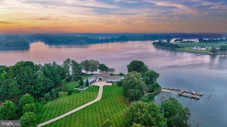 Experience the epitome of Eastern Shore living in this modern treasure sited on 4+ acres.  Enjoy serene views of the Wye River, ever-changing flower gardens, sunrises, and wildlife.  This 4-bedroom, 3-full bath, 2-half bath residence was recently renovated in 2018 with a Gourmet Chef’s kitchen, library, primary bathroom oasis, and enclosed breezeway, all with the finest fixtures and finishes, as well as new A/C and air handlers.  The main level also offers a spacious primary suite with wood-burning fireplace and sitting area, a family room with wood-burning fireplace, a dining area, and a laundry area. Upstairs, a charming loft area awaits, providing an inviting space for relaxation, as well as two generously sized bedrooms and a well-appointed full bath.  Additionally, a spacious storage room ensures ample space to keep your belongings organized and easily accessible.  Find additional space for guests in the private, 1 bedroom, 1 bathroom apartment above the conditioned 3-car garage.  Other property features include a deep-water dock with boat lift, boat ramp, riprapped shoreline, raised bed gardens, computer-controlled, 40-zone irrigation system with rain sensor, lightning rods, alarm system, crab shack, generator, encapsulated crawl space, soft water system, UV water treatment system, plumbed, gas cooktop barbecue, and a gunite, saltwater pool with waterfall, spa area bubblers, fire pots, and tanning ledge.  This property combines unparalleled elegance, stunning natural surroundings, and an array of luxurious amenities.  Easton, Maryland, known as the New Hamptons of the Chesapeake Bay by Forbes Magazine, is conveniently located 1.5 hours from D.C. and Baltimore, 2 hours from Philadelphia, and just minutes from fine dining, shopping, healthcare, theatres, galleries, museums, golf courses, a country club, a yacht club, and a jet airport.