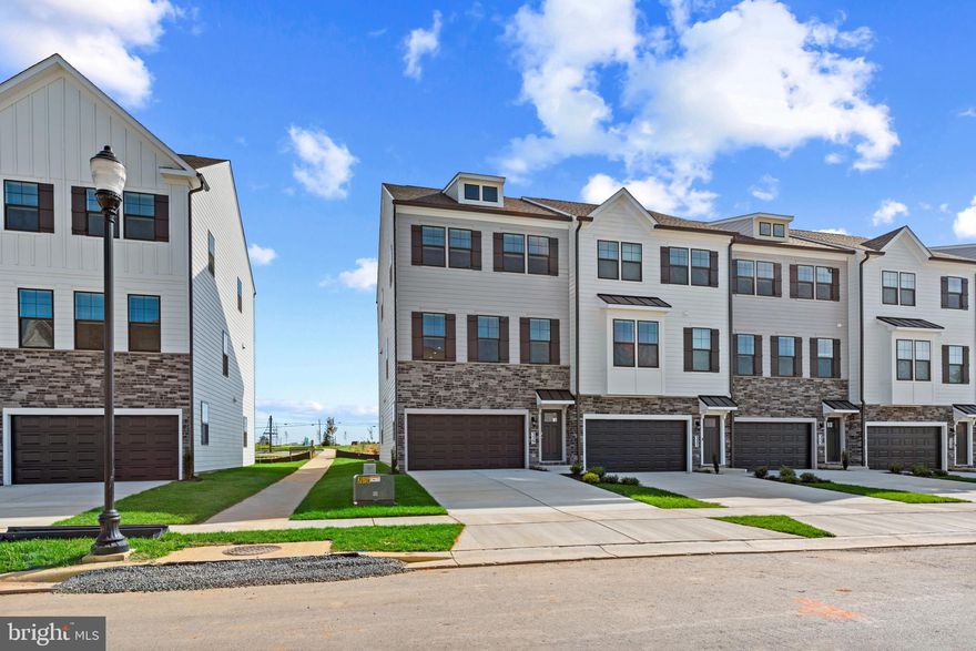 Move-in January! Brand New End Unit Auburn Townhome at D.R. Horton’s Renn Quarter – Your Dream Home Awaits! Welcome to the stunning Auburn townhome plan, now available at the highly sought-after Renn Quarter in Historic Downtown Frederick, MD. With over 2,270 square feet of spacious living, this beautiful 4-bedroom, 3.5-bathroom home with beautiful deck and fencible backyard offers modern living with unbeatable convenience and style. Renn Quarter is an amenity-rich lifestyle community that perfectly blends the charm of downtown Frederick with brand-new, modern homes. The Auburn plan is designed for the way you live today, featuring soaring 9-foot ceilings, a standard gourmet kitchen with sleek stainless-steel appliances, and luxurious plank flooring throughout. The open-concept layout flows effortlessly from the kitchen to the spacious living areas, creating the perfect space for both family time and entertaining guests. Your new home boasts a spacious master suite with a luxurious master bath and walk-in closet, providing the perfect private retreat. The Hardwood Stairs, Bedroom Level Laundry Room, and 2" blinds add even more ease and comfort to your daily life. Located in the Newly released section of D.R. Horton’s Renn Quarter, this home is just a short walk or bike ride to all the best shopping, parks, dog parks, and dining in downtown Frederick. Enjoy the future Carroll Creek Walkway Extension right outside your doorstep, along with the open spaces, trails, and creeks that Renn Quarter will offer. This is the last residential community in the area that will be considered walkable downtown, providing you with a truly unique blend of convenience and modern living. Whether you’re relaxing at home or out enjoying the vibrant downtown, Renn Quarter offers it all. This home is ready for you to call it your own! Contact us today to schedule a showing and let us help you make your dream home a reality.