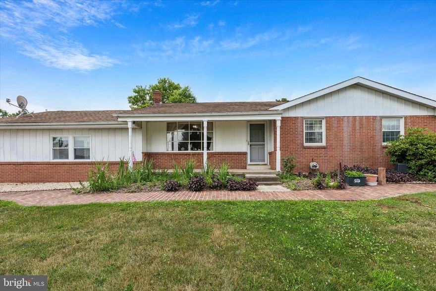 Welcome to this expansive well maintained 4 bedroom, 2.5 bath ranch style home situated on a premium lot with over 1.5 acres! One floor living at its best! Whether you need a separate living space with its own entry access or would love an additional recreational living space, this home offers you options and plenty of space for everyone. Rarely found in traditional home floor plans..  sprawling would best describe this home!  Enter the front door into the large open living room and dining room full of natural light, greeted by beautiful hardwood floors. Step in into the spacious updated eat in kitchen with granite countertops, tile backsplash, center island, plenty of cabinetry and counter space. Sit back and enjoy the scenic view of the private wooded back and side yard from here. Down the hall are 3 nice size bedrooms and an updated hall bath. Primary bedroom with its own private half bath for convenience. In addition, there's a seperate entrance from the dining room and outside that takes you to the 4th bedroom and has potential to be converted into an inlaw suite. Full unfinished basement for additional storage and endless possibilities. This is a must see home with a premium location and lot in the highly sought after Souderton Area School District, just waiting for your personal touches! Schedule your appointment today!