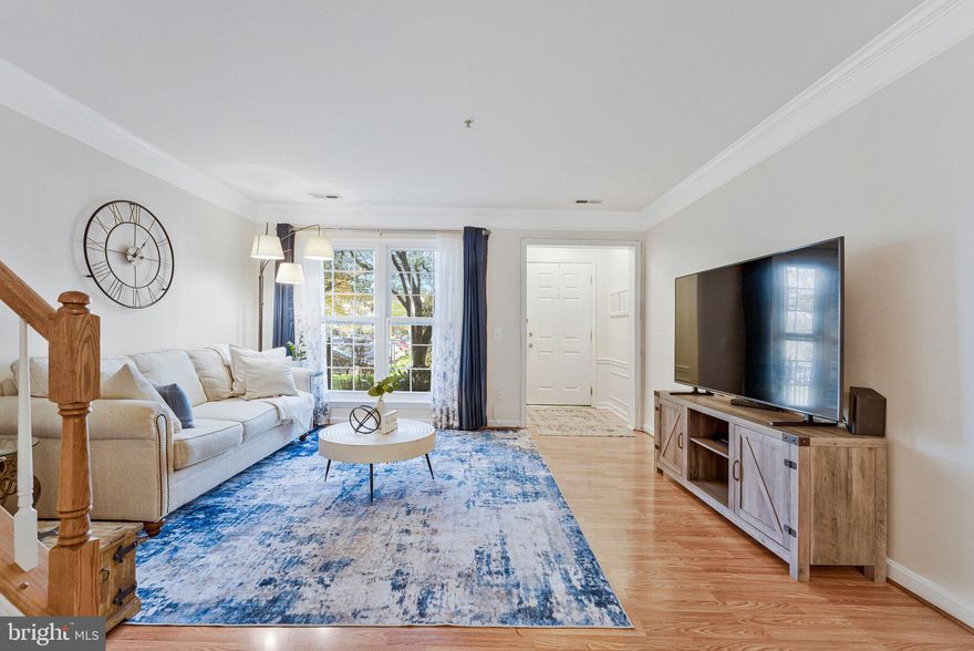 Have you been looking for a ground level unit in the highly desired community of Chatham Greens? This incredibly pristine and kept 2 bedroom - 3 bathroom home is the one you've been waiting for! This 2 level condo has been beautifully maintained with plenty of updates. The ground level entry greets you with a welcoming foyer featuring gleaming laminated floors and crown molding, leading to a generously sized living room with large windows that flood the space with natural light. This layout flows seamlessly into the dining area boasted by a stylish linear chandelier. You will be welcomed by an open and bright kitchen with a breakfast bar seated peninsula, white cabinetry and countertops, stainless steel appliances, and new(2026) vinyl flooring. The generously sized family room truly stands out as a place of leisure and lounge. A marble surrounded gas fireplace flanked by built-in shelving, bold accent walls, and a rear French door patio walkout overlooking lush, green space gives you just the right feel of luxury and repose. 

*** *** 

Upstairs, the master suite impresses with new(2026) plush carpet, ceiling fan, and a private en suite bath showcasing dual sinks with newly updated faucets, new(2026) vinyl flooring, a soaking tub, and a freshly, 2026 updated separate glass-enclosed shower with subway tile to compliment. Across the hall another generously sized bedroom on the upper level offers new(2026) carpet and ceiling fans, served by a well-appointed full bath with new(2026) vinyl flooring and newly(2026) updated faucets.  Additional updates include new(2023) Thompson Creek windows with a 20-year warranty, a brand new(2026) HVAC with a transferable service plan, and a new(2025) dishwasher. The community features a pool and professional landscaping, with water and trash included in the HOA fees. 

*** *** 

Have you been looking for easy access to retail and grocery stores? For your convenience, the Town Center of Sterling is a short 2-3 minute drive. There are plenty of Restaurants close by for those of us who love to dine out. If you feel a desire to spend more time outdoors, there are many trails and outdoor activities. The Potomack Lakes Sportsplex, The Algonkian Regional Park, Volcano Island Waterpark, Algonkian Golf Course, Trump National Golf Club, and the Potomac River are all roughly 15 minutes away. In addition to the many amenities coupled with this home, and short distances; Seneca Regional Park, Great Falls Park, Nova Community College, Dulles Town Centre, and Dulles International Airport are all approximately 15 minutes away from Home. Unbelievable!! To Live Here is to be the Center of Your World! *** *** Can you afford to miss out on this opportunity?!