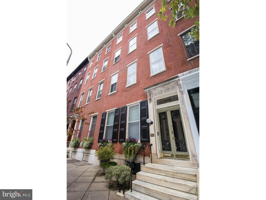 One of a kind impeccably maintained mid-19th Century triplex, with large owner's residence on one of the finest tree-lined blocks in Rittenhouse Square. This is a fantastic opportunity for an owner to live in one residence and generate income from the other apartments, or to transform into a tremendous single family home.  The current annual income is $41,700.  The owner's home is an incredible tri-level 4 bedroom plus den beginning on the second floor and featuring a deck and large 1-car garage. Enter into a grand hallway with high ceiling, skylight, crown molding, closet area, and a powder room.  The beautiful kitchen offers hardwood floors, maple cabinetry, Corian countertops, stainless steel appliances, farm sink, and island counter open to the dining area with a working gas fireplace and built-in window seat.  Double French doors lead into the open living room with original wood and brick mantle, picture molding, and 3 south-facing windows.  Steps lead to the next level with a spacious den and French doors opening up to a fantastic Ipe wood deck- ideal for morning coffee and evening wine! On the next level are the master bedroom and bathroom along with a spacious south- facing den with built- in book shelves that can also be used as a bedroom.  On the top level you'll find two bedrooms, a spacious hallway bath, a storage room, and laundry.  The first floor apartment is a junior 1 bedroom featuring an open living/dining area with large windows, 13 ft ceilings, and a kitchen.  The sleeping area offers a walk-in closet with built- in shelving and a newly renovated full bath with subway tile. The second floor rear apartment is a gracious bi-level 1 bedroom, 1.5 bath offering an elegant living room with a bay window, detailed plaster moldings, fireplace, glass-enclosed book shelves, and a powder room. The eat-in kitchen features maple cabinetry, subway tile backsplash, stainless steel appliances and a pantry. A wood and steel spiral staircase leads down to the bedroom with a bay window, two walk-in closets, and a full bath. There is a common hallway with coat closet, gilt mirror, decorative plaster molding, and a side door leading to the owner's garage. The basement has a finished area with an office alcove, laundry, a storage room, and a mechanical room. This property features 6 fireplaces, high ceilings, and original hardwood floors throughout.