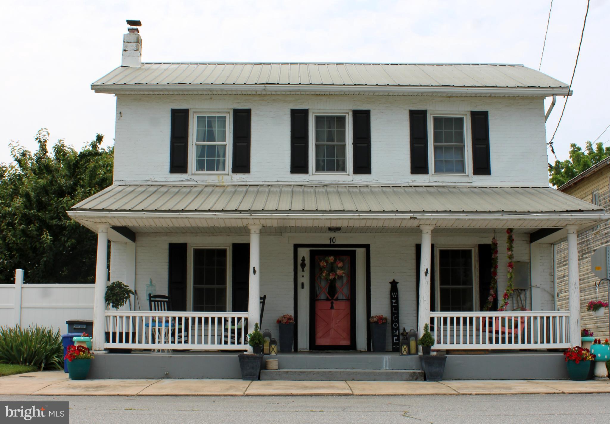 Back on the market—buyer financing fell through! Historic 160-year-old Colonial full of charm and potential. With a little TLC, this home will easily last another 160 years. Features include a traditional floor plan, hardwood floors, formal dining room with chandelier, 3 bedrooms, 2 full baths, and a spacious kitchen. Relax on the large front porch with a classic porch swing. The huge privacy-fenced backyard is perfect for entertaining, Detached garage plus a two-story carriage house (currently used as a studio) that could be restored for additional space or storage. Located in a neighborhood rich with character. Seller is motivated and offering 3% seller help! Don’t miss this rare opportunity.