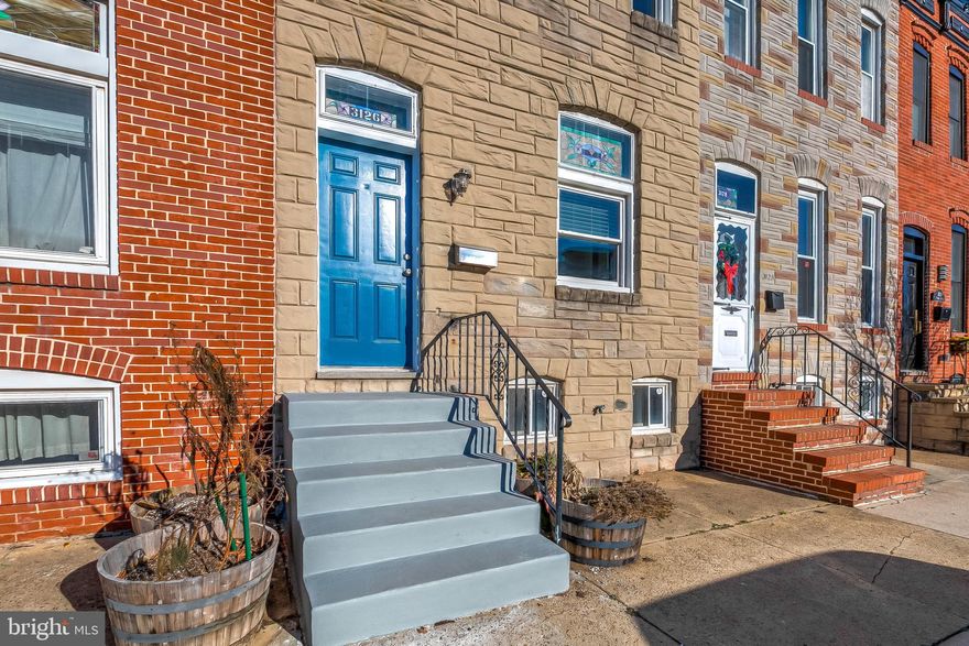 Location is the name of the game in this "heart of Canton" gem!  You'll love this spacious 2BR, 1.5 bath townhome located just a few blocks from Canton Square and the Waterfront Promenade.  The main living and dining areas of this home are larger than many similarly priced homes, creating a wonderful opportunity for nicely sized furniture, a dining area and complementary built-in bar with wood-plank tile backsplash.  There are beautiful hardwood floors throughout the main living level along with a stained glass transom windows to add Baltimore character.  The open concept kitchen features granite counters, stainless appliances, beautiful cabinetry, recessed lighting and a breakfast peninsula.  No going to the basement to do laundry . . .this home has a convenient laundry/mud room with laundry sink, as well as a first floor powder room that leads to a large and secluded rear patio perfect for outdoor entertaining.  Upstairs you'll love the huge owner's bedroom with a spacious walk-in closet and so much natural light -- 3 windows wide!  There is a second bedroom as well as a large updated full bath with double vanities and a huge tiled walk-in shower with glass doors.  A tidy, unfinished basement provides ideal storage.  Gas heating and cooking along with separately zoned AC.  Fresh paint and nice updates throughout! In addition to the fantastic location, the dimensions and room sizes make this home a winner!