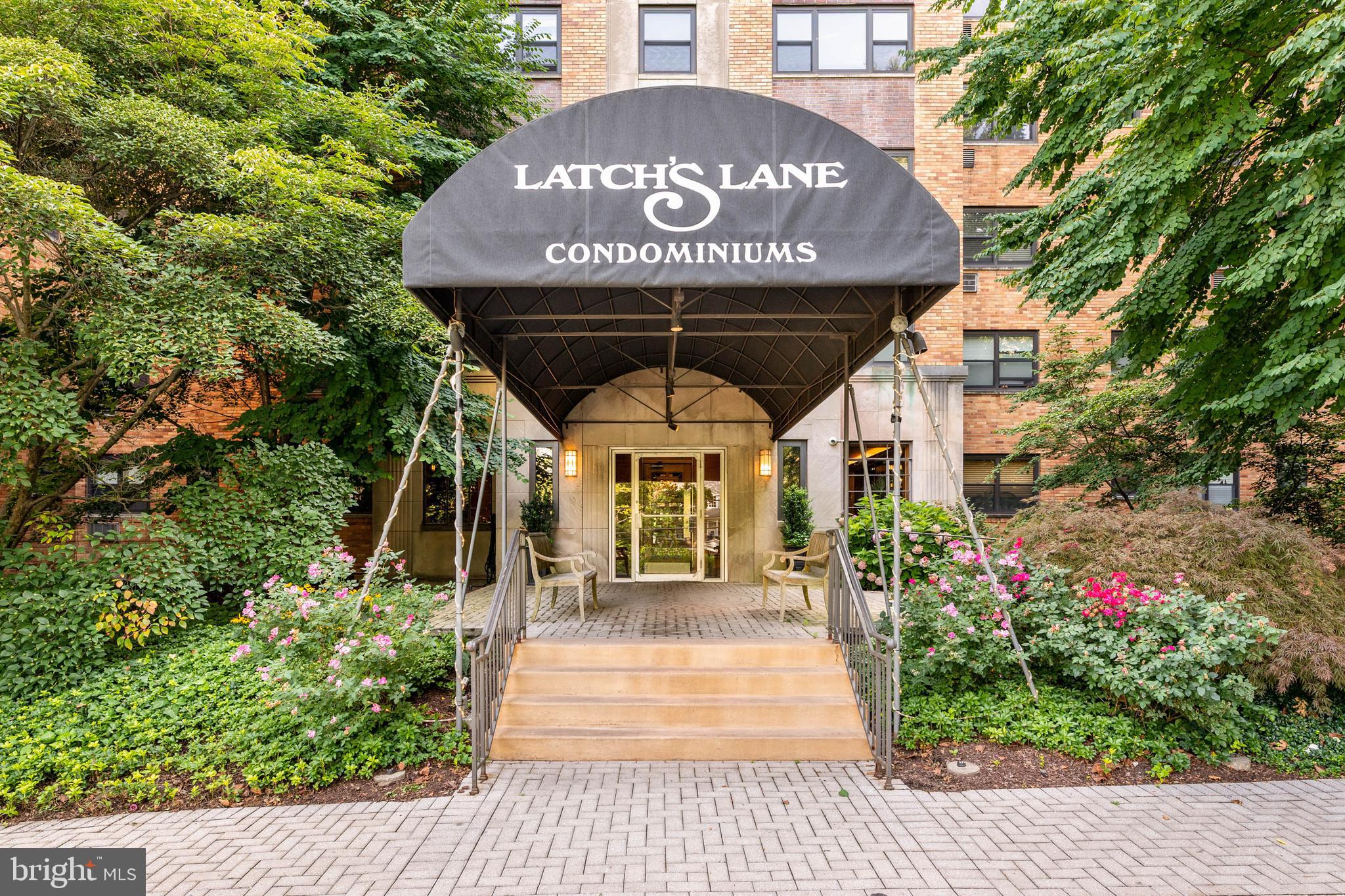 Welcome to Apartment #408 in the highly-sought after Latch’s Lane Condominium! This unit is a rare find in a coveted Main Line location- a 1-bedroom, 1-bathroom apartment perfect for those looking for accessibility and low-maintenance living. The setting is truly unmatched: with an ideal balance of suburban tranquility and urban access thanks to Merion train station along the Paoli/Thorndale line— you’ll never have to compromise green space, privacy, and quiet for walkability and convenience. Boasting amenities including a fitness center, community room, laundry room, and a gorgeous pool, what’s not to love about Latches Lane? Don’t forget, being in Merion Station means access to phenomenal parks, shopping, and restaurants as well as award-winning Lower Merion School District.
Set on a tranquil, residential street, the Latch’s Lane Condominium blends in well with the neighborhood, filled with classic and well-maintained homes. As you enter, you’ll appreciate the elegant lobby which greets you with the 1940s charm you’ll find throughout the rest of the building. Speaking of charm, apartment #408 boasts gleaming parquet flooring throughout. As a 1-bedroom, 1-bathroom, the unit offers the ideal amount of space without being too much to manage. You’ll find everything you need both within your building and beyond, as Merion Station offers access to plenty of popular parks, restaurants, libraries, and shopping— there is always something for everyone. This apartment is a phenomenal value in an unbeatable location: don’t miss out on Latch’s Lane!