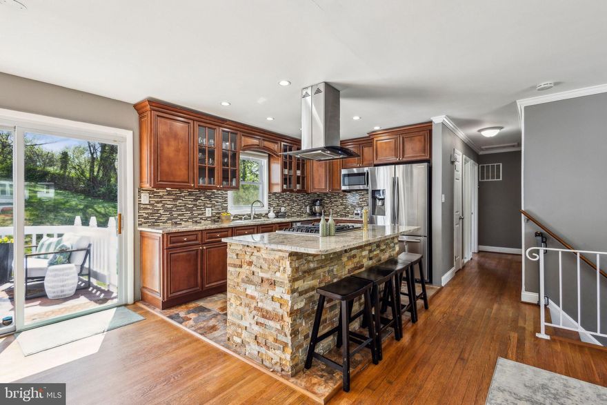 Welcome to 14709 Dunbar Lane!

If you’ve been searching for a tastefully updated home that delivers both space and comfort, this one checks all the boxes. Ideally located just minutes from I-95, Potomac Mills, and a variety of shopping and dining options, this 4-bedroom, 2-bath bi-level home with a garage and main level primary suite is tucked away on a quiet street with a spacious yard. It’s the perfect blend of timeless charm and modern upgrades.

Step into the main level and you’re immediately welcomed by a large, open living area featuring a cozy fireplace as its centerpiece. Just off the living space, the generously sized main level primary suite offers ample closet space and a serene retreat at the end of the day. Across the hall, you’ll find a fully updated bathroom with a sleek standing shower. Need space to unload and recharge after a long day? The oversized mudroom/laundry room, located off the garage, offers plenty of storage, a second fridge, and room to organize your laundry day.

Upstairs, natural light floods an airy open-concept layout with gleaming hardwood floors that flow seamlessly from one space to the next. The dining room offers plenty of room to entertain, but the true showstopper is the kitchen—a stylish and functional chef’s dream. Featuring a Samsung stainless steel appliance package, a natural gas range, and a spacious center island, this kitchen is as fabulous as it is functional. Also on this level are three additional well-sized bedrooms and a beautifully renovated full bathroom with a tub.

Step outside and enjoy a variety of outdoor spaces designed for both relaxation and entertaining. A freshly painted deck off the kitchen is perfect for enjoying your morning coffee al fresco. There’s also a charming covered front patio and a large rear stone patio—plenty of space for a grill, garden beds, a firepit, or whatever your heart desires. You’ll never run out of options for enjoying the outdoors.

Thoughtful Upgrades Throughout:
• 2015: Architectural shingle roof installed
• 2016: Kitchen renovated with Forever Mark cabinets, upgraded sink, and Samsung appliances
• 2020: Stone patio added
• 2020: Driveway widened and repaved for enhanced curb appeal
• 2020: Guest bathroom fully updated with shower, tilework, vanity, and flooring
• 2022: Ceiling fans upgraded in upstairs bedrooms
• 2022: HVAC system replaced with UV air purification, built-in humidifier, and a 10-year parts and service warranty
• 2022: Electrical panel upgraded
• 2022: New water heater installed
• 2022: Laundry room updated with new cabinets and countertop
• 2022: Primary bathroom fully renovated with new tile, vanity, shower, and flooring
• 2022: Primary suite closet expanded with a custom built-in wardrobe system

This home is the total package —stylish, functional, and full of upgrades. Don’t miss your chance to make 14709 Dunbar Lane your next home. Reach out to Gloria Griner to schedule your showing today—your new chapter starts here.