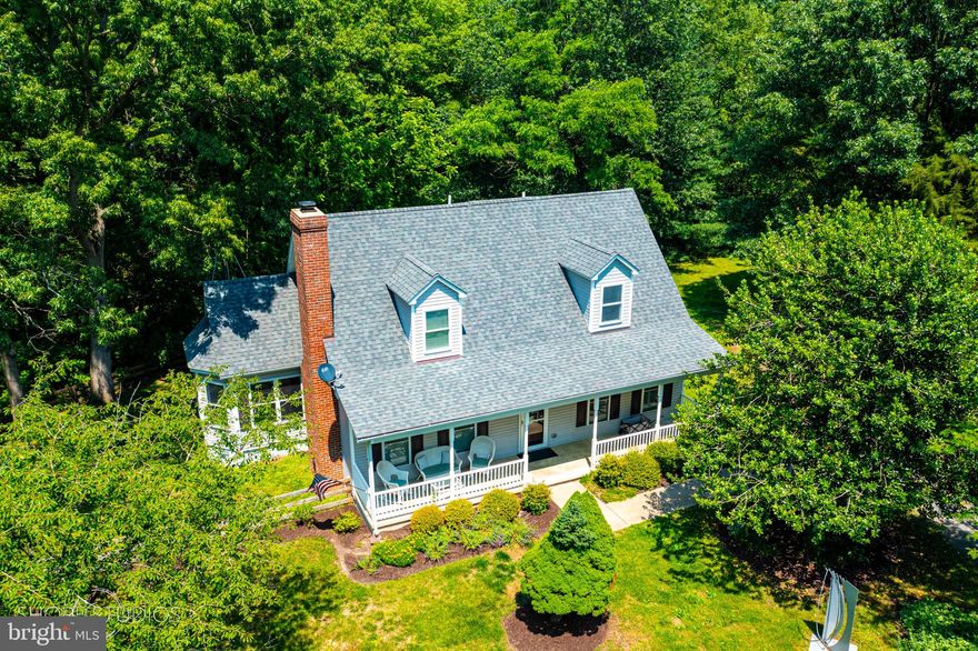 Lovely countryside Cape Cod on over 3 private acres.  Sit on the front porch and enjoy the summer breeze or grill off the back deck and watch the deer in the woods.  This home has been meticulously cared for and features a first floor primary bedroom with walk-in closet and ensuite bath with a massive ceramic tile shower.  Large formal living room with brick fireplace flows into the kitchen / dining room combo behind with sun-room and back deck.  Recent upgrades include: crawl space encapsulation, stainless steel kitchen appliances, downstairs heat pump, backyard fence, solid wood plantation shutters, automatic retractable blinds and more.  Quick drive to historic downtown Chestertown.  Founded in 1706, Chestertown sits on the banks of the Chester and is home to Washington College.  Enjoy the historic homes, local shopping, restaurants, art galleries, and waterfront parks.  Chestertown is home to many festivals, an award-winning weekly Farmer's Market, and a brand new YMCA.  Enjoy easy country living on the Eastern Shore.