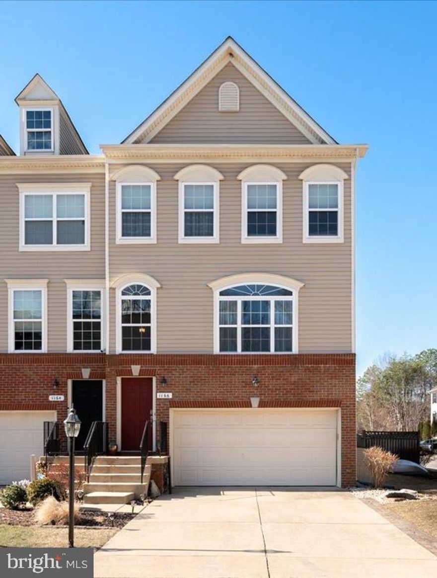 Welcome to 1166 Colbourn Corner, a beautifully maintained end-unit townhome located in the amenity-rich community of Tanyard Springs. This three-level home offers over 2,300 square feet of living space, featuring hardwood floors, a bright and open main level, and a spacious kitchen with ample cabinetry and counter space. The separate dining area and living room flow seamlessly to the large deck—perfect for entertaining or enjoying your morning coffee.

Upstairs, the private primary suite offers vaulted ceilings, a walk-in closet, and a large en suite bath with dual vanities, a soaking tub, and a separate shower. Two additional bedrooms share a full hall bath, and the laundry is conveniently located on the upper level.

The finished lower level features a cozy rec room, half bath, and access to the fully fenced backyard with a flagstone patio and fire pit. A Two-car garage and driveway offer convenient parking.
Tanyard Springs is a sought-after community with amenities that include a clubhouse, outdoor pool, 24-hour gym, tennis and basketball courts, dog parks, walking trails, and multiple playgrounds. Easy access to I-695, Route 100, Fort Meade, Baltimore, and Annapolis.

Don’t miss this opportunity to enjoy low-maintenance living in a vibrant and well-kept neighborhood. Schedule your showing today.