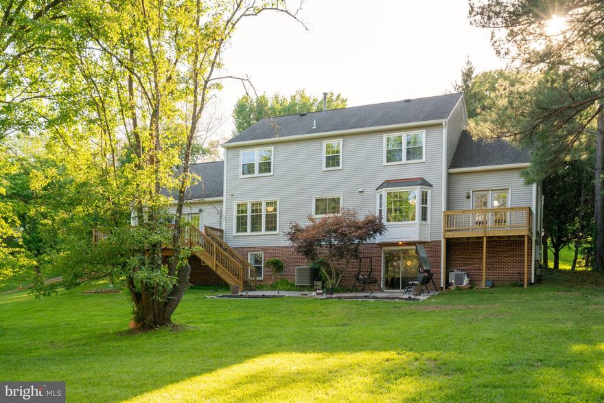 Beautifully updated and move-in ready, this expansive Harvest Ridge home offers over 5,200  sq ft on a private 0.83-acre lot. Featuring 5 bedrooms and 3.5 baths, including a newly added full bath in the finished walkout lower level (approx. 1,500 sq ft), this home delivers space, comfort, and flexibility for today’s lifestyle.

The main level includes formal living and dining rooms, a private office, and a spacious family room with a custom media wall and electric fireplace. A bright sunroom overlooks the serene, tree-lined backyard. The kitchen features custom maple cabinetry, granite countertops, glass tile backsplash, walk-in pantry, and main-level laundry.

Recent updates include energy-efficient windows (5–6 yrs), HVAC (2020), and in 2024: new gutters, garage doors, front entry door, and exterior lighting. Hardwood floors span most of the main and upper levels.

Upstairs, you’ll find five generously sized bedrooms. The finished lower level offers versatile space for a rec room, media area, guest suite, or gym, plus a full bath and abundant natural light.

Enjoy outdoor living with a flat, private yard and oversized deck (2016), perfect for entertaining. Additional updates include kitchen renovation (2013) and roof replacement (2004).

Ideally located just minutes to Tysons Corner Center, Wolf Trap National Park for the Performing Arts, The Boro Tysons, and the shops and restaurants of Reston Town Center, with easy access to major commuter routes—this one has it all!