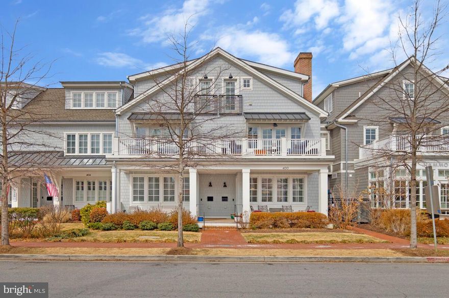 Embrace the ease of true coastal living in this beautifully appointed home, ideally situated just a short stroll from the waterfront and the bustling center of Downtown Annapolis. Blending classic seaside charm with refined finishes, this meticulously curated home features stunning interiors, where every detail reflects superior craftsmanship and thoughtful design. Rich hardwood flooring, custom moldings, and classic plantation shutters establish a sophisticated ambiance throughout. The formal living room, anchored by a gas fireplace, offers an inviting yet polished setting for both intimate evenings and gracious entertaining. At the heart of the home, the gourmet kitchen is impeccably appointed with professional-grade Thermador appliances, an expansive Silestone center island, and a custom-designed polished nickel pot rack by Ann Morris—a striking statement of artistry and function. Step out to the covered patio overlooking the thoughtfully designed gardens, creating a seamless transition between refined interiors and serene outdoor living. The primary suite is a sanctuary of comfort and privacy, featuring two substantial walk-in closets, a spa-inspired bath and a private balcony. A separate den on the primary suite level with its own balcony provides space for a study or a quiet reading room. The third level features two additional ensuite bedrooms both with vaulted ceilings, one offers a private balcony and the other a French balcony - both bathed in natural light and architectural character. Completing this exceptional offering is a detached two-car garage with unfinished storage above and the added exclusivity of private gated parking. Perfectly positioned within walking distance to Downtown Annapolis’ acclaimed restaurants, boutiques, and cultural attractions, this home presents a rare opportunity to experience coastal living with grace, sophistication, and enduring style.