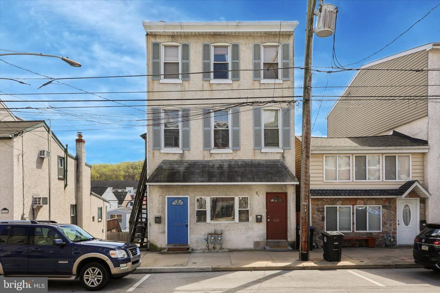 Rare duplex in the heart of Conshohocken – ideal for investors or owner-occupants! 325 E Hector Ave is perfect for a homebuyer looking to live in one unit and rent the other, or for an investor seeking to expand or start their real estate portfolio. Both units are spacious, stylish apartments with long-term tenants in place or can be given a 60-day notice, to deliver the property vacant, providing flexibility for the new owner. Unit 1 is a bi-level 3 bedroom with 2 full baths. Enter through the living room/dining room with hardwood floor and soaring ceilings, followed by flex space that can be utilized for an office, playroom, library etc, and access to the basement can also be found here. Kitchen is adjacent to a mud room (both of which have new flooring)  and has an oversized island, tile backsplash and brand new refrigerator. From the rear of the first floor you have access to the deck where you can entertain guests all summer long. Upstairs, you will find 3 oversized bedrooms, a full bath (renovated in 2024), and in unit washer and dryer for added convenience. Unit 2 is a 1 bedroom, 1 full bath apartment with large living room and generously sized kitchen with 12 in tile flooring. A washer and dryer is neatly tucked away in the kitchen for added convenience. Unit 2 also has access to the shared basement for storage as well. Additional features include off-street parking for 3, you will never be without a parking space.  Located within walking distance to Conshohocken’s vibrant dining, shopping, and nightlife, this property also provides easy access to the train station and major highways, including 476, 76, and 276. Whether you’re looking to live in one unit and rent the other, or add a prime rental to your portfolio, this property checks all the boxes. Tenants pay electric/gas, and owner pays water/sewer/trash.