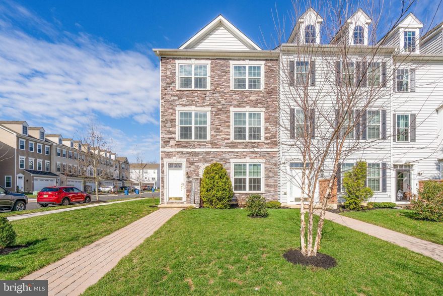 Welcome to 1116 Goddard Way in the sought-after Meridian Crossing community. Built in 2021, this beautifully upgraded end-unit townhome with a stone front offers modern design, thoughtful enhancements, and a lifestyle of comfort and convenience. Step inside to the lower level where a spacious family room greets you, perfect for a second living area, home office, or entertaining space. This level also features a laundry area with upgraded tile flooring, a rough-in for a future half bath, and access to the two-car garage and private driveway. The garage includes an EV charging outlet, adding convenience for today’s lifestyle. The main living level is filled with natural sunlight and showcases luxury vinyl plank flooring throughout. The open-concept layout is designed for both everyday living and entertaining, centered around a beautifully designed kitchen featuring upgraded level 2 cabinetry, granite countertops, a tile backsplash, stainless steel appliances, double ovens, a wine fridge, and soft-close drawers. The large eat-in island offers the perfect space for gathering. Tasteful crown molding enhances the breakfast nook, creating a warm and inviting setting for your morning coffee. Step outside onto the spacious maintenance-free Trex deck, ideal for grilling, entertaining, or relaxing by the firepit. The dining and living areas flow seamlessly, providing an ideal space to host, relax, and enjoy time together. Upstairs, retreat to the primary suite featuring a customized PAX walk-in closet system and a spa-inspired bathroom complete with a soaking tub, offering the perfect place to unwind. Two additional spacious bedrooms and a full hall bath complete this level. Additional highlights include a half bath updated in 2025 and the added privacy and natural light that come with being an end unit. Located in a community known for its amenities and convenience, this home offers the perfect balance of style, space, and functionality. Schedule your private tour today and experience everything this exceptional home offers.