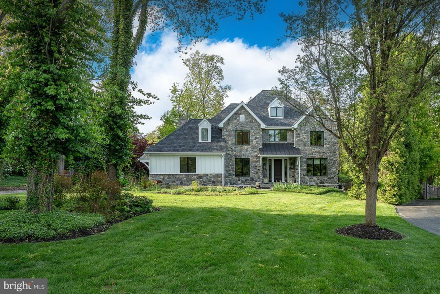 Stunning 4-Bedroom home with a magnificent swimming pool & outdoor kitchen in a prime Gladwyne, walk to everything location.  Set on a private, quiet cul-de-sac in sought-after Gladwyne and located in the award-winning Lower Merion School District, this beautifully maintained 4-bedroom, 3 full bathroom, and 2 half bathroom home is truly an entertainer’s dream.  Step inside through a dramatic two-story center hall entryway that sets the tone for the sophisticated yet comfortable layout. Rich dark hardwood floors run throughout the main level, seamlessly connecting the elegant formal living room with crown molding, to the spacious dining room featuring classic chair rail detail and serene views of the pool area. The heart of the home is the gourmet eat-in kitchen, equipped with a center island, top-of-the-line appliances, walk-in pantry, and a bright breakfast area that flows effortlessly into the cozy family room with a beautiful stone gas fireplace. Just beyond, the sun-drenched vaulted-ceiling sunroom offers lovely backyard views and access to the expansive back patio. The outdoor space is second to none, featuring a fabulous outdoor gourmet kitchen with a built-in BBQ grill, smoker, refrigerator, and sink, plus a sparkling in-ground gunite, heated saltwater swimming pool, and a level, fenced-in yard—ideal for gatherings, summer fun, or quiet relaxation. A convenient half bath, mudroom, and laundry room off the kitchen lead to the attached 2-car garage.  Home office with wall of built-in bookshelves sits just off the entry and completes this level.  Upstairs, the luxurious primary suite boasts vaulted ceilings, two walk-in closets, and a spa-like en-suite bath with double vanity, soaking tub, and separate walk-in shower. A second bedroom suite includes a custom-outfitted closet and a private bathroom with a walk-in shower. Two additional spacious bedrooms share a full hall bathroom with a double vanity and tub. The fully finished lower level offers something for everyone—an amazing, top-of-the-line home theater with snack bar seating and a second kitchen/bar (including refrigerator, sink, and dishwasher), a playroom, a home gym, and an additional half bathroom.  Enjoy walkable access to the charming Village of Gladwyne and the local elementary school, with convenient proximity to major roadways for an easy commute. Do not miss this incredible opportunity to own a home that truly has it all—space, luxury, and a location that can not be beat.